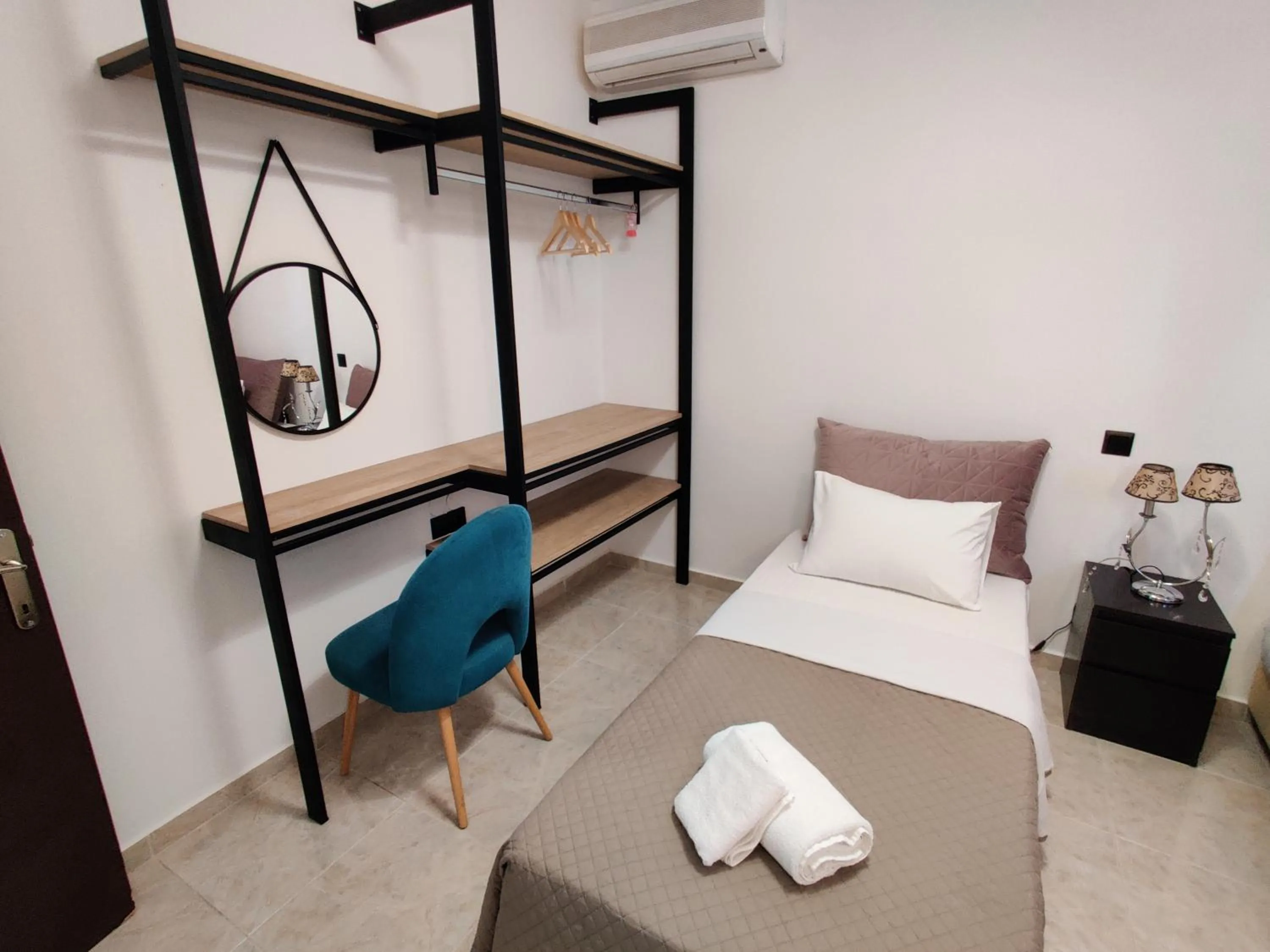 Bed in Victoria's Suites Corfu