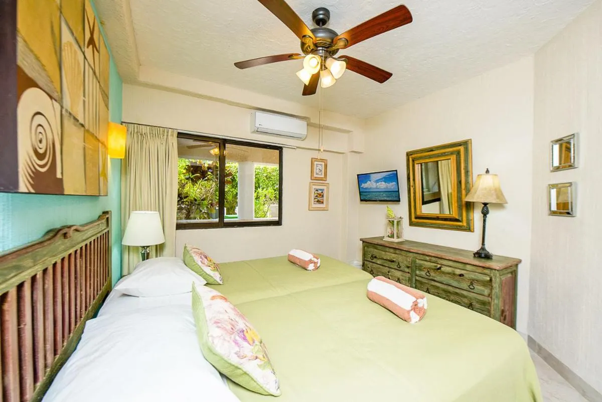 Bed in Xaman Ha Beach Front Condo
