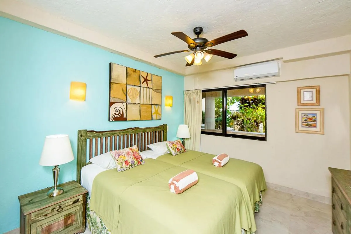 Bed in Xaman Ha Beach Front Condo