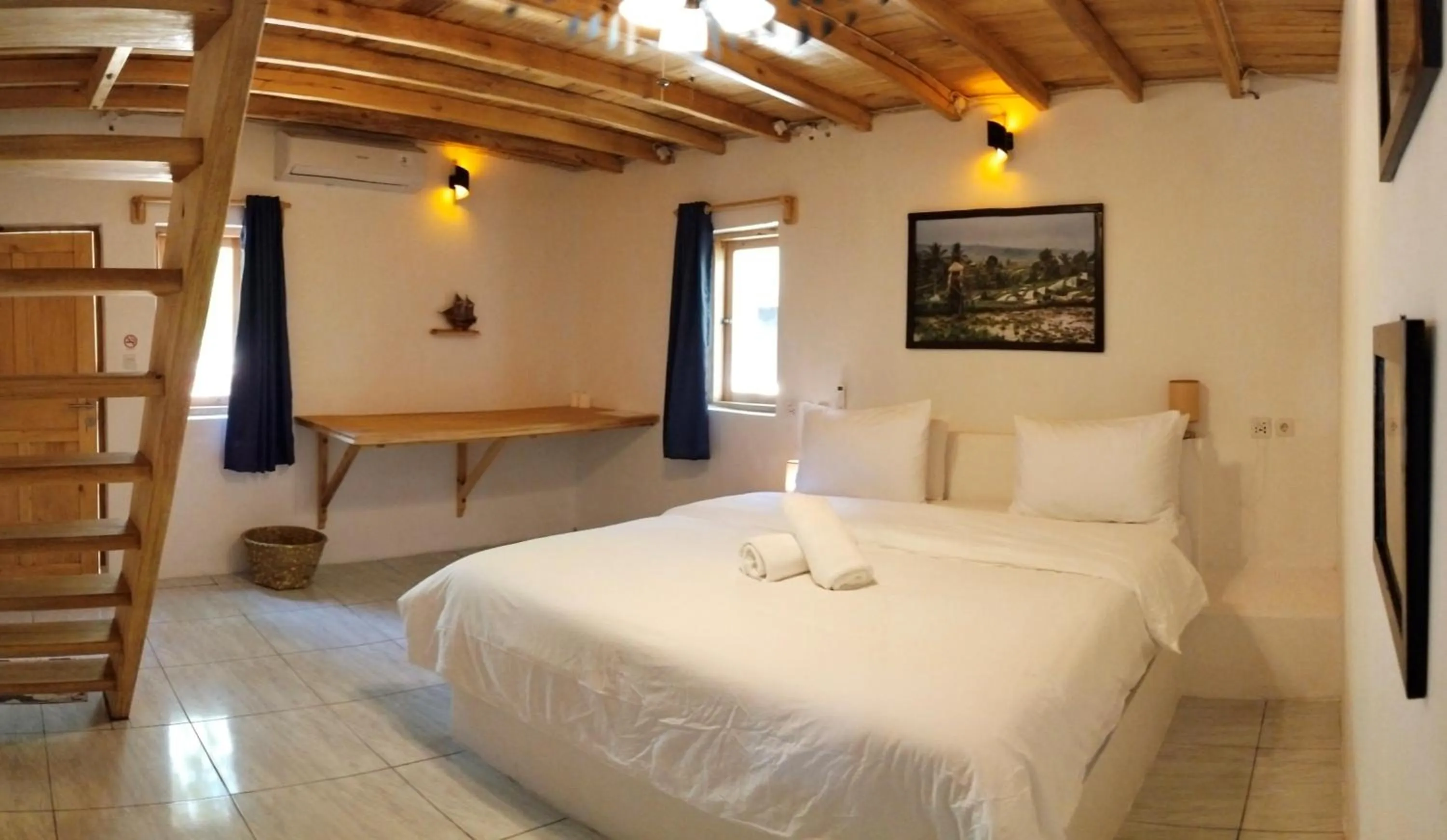 Bed in Blue Planet Dive Resort