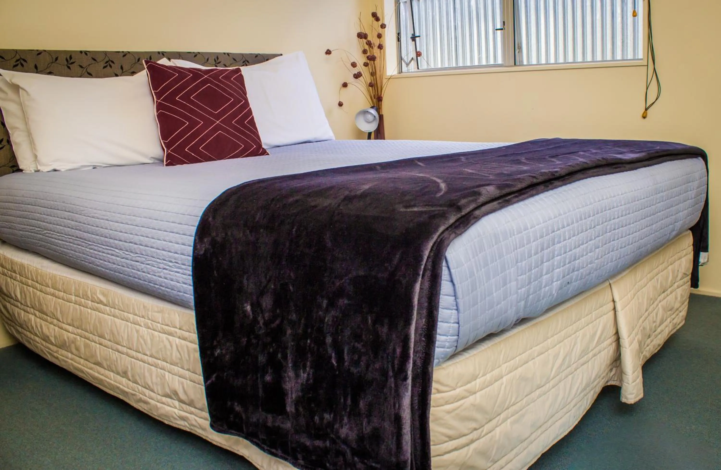 Bed in Bella Tuscany Motor Lodge