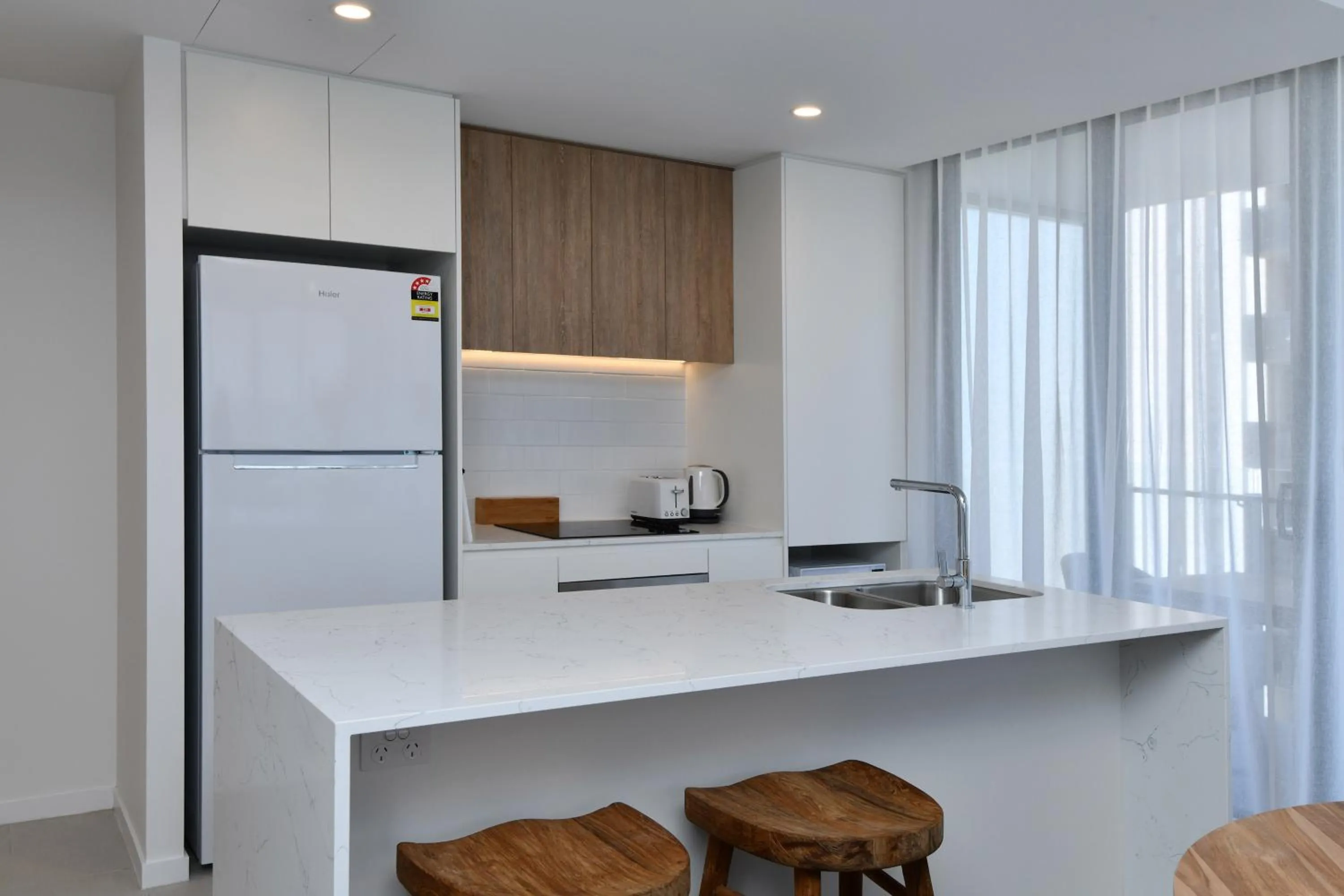 Kitchen or kitchenette in X Kirra Apartments