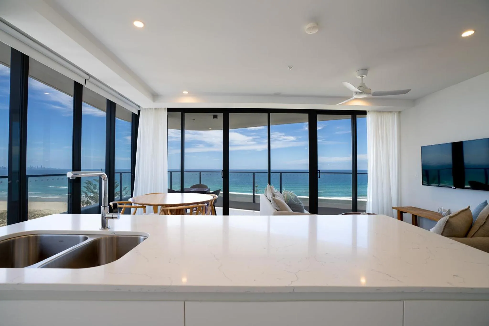 Dining area in X Kirra Apartments
