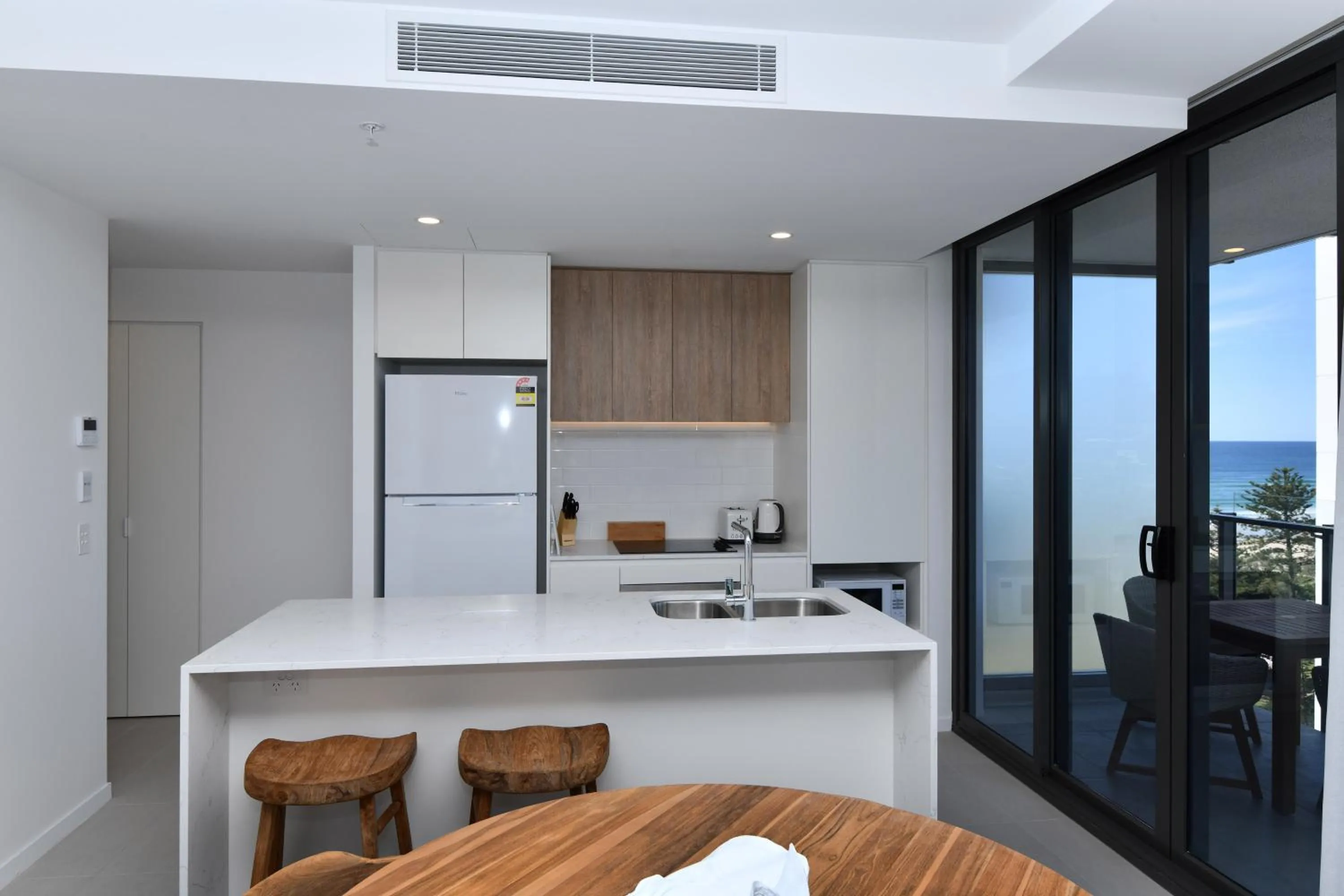 Kitchen or kitchenette in X Kirra Apartments