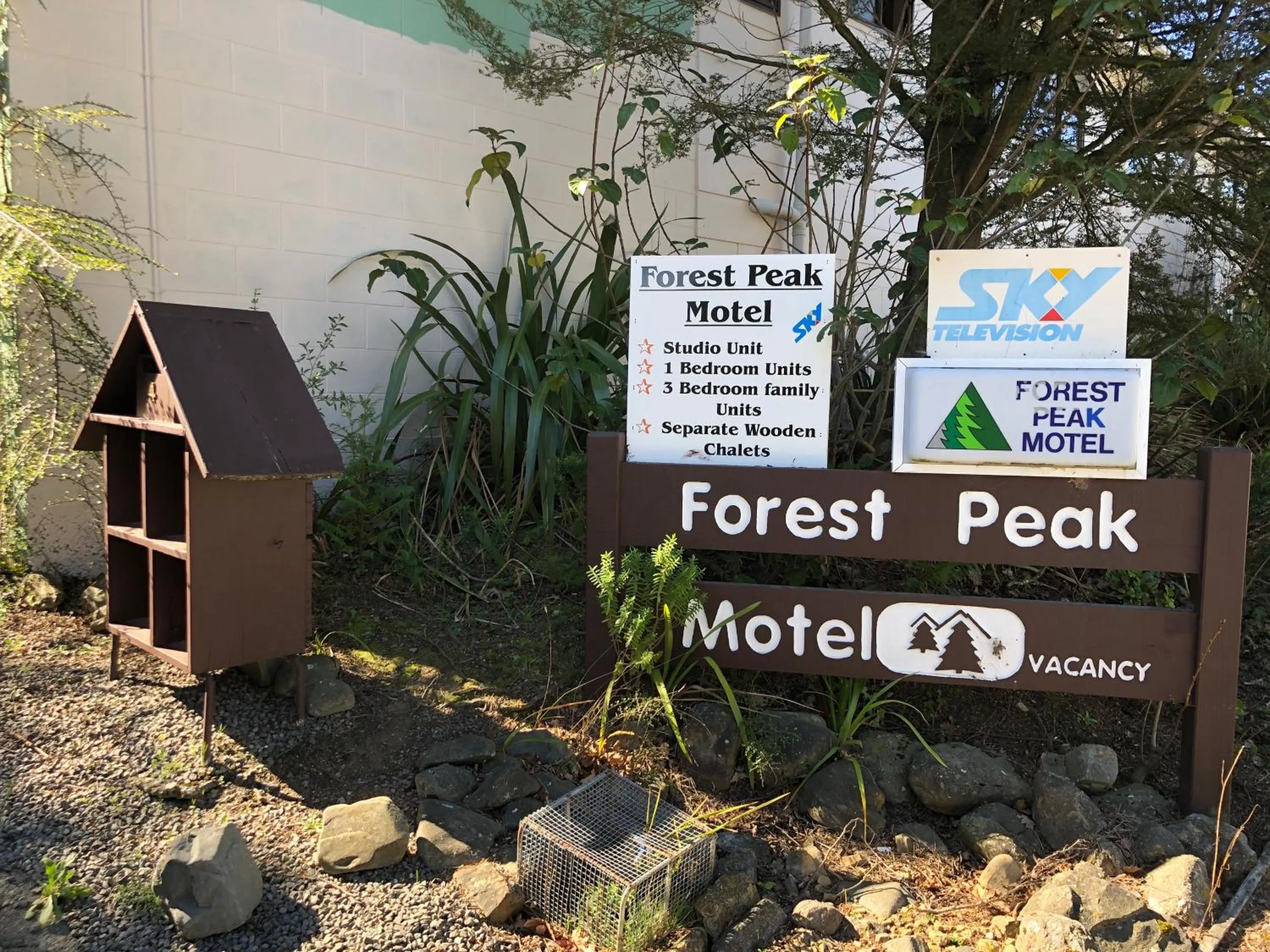 Property logo or sign in Forest Peak Motel