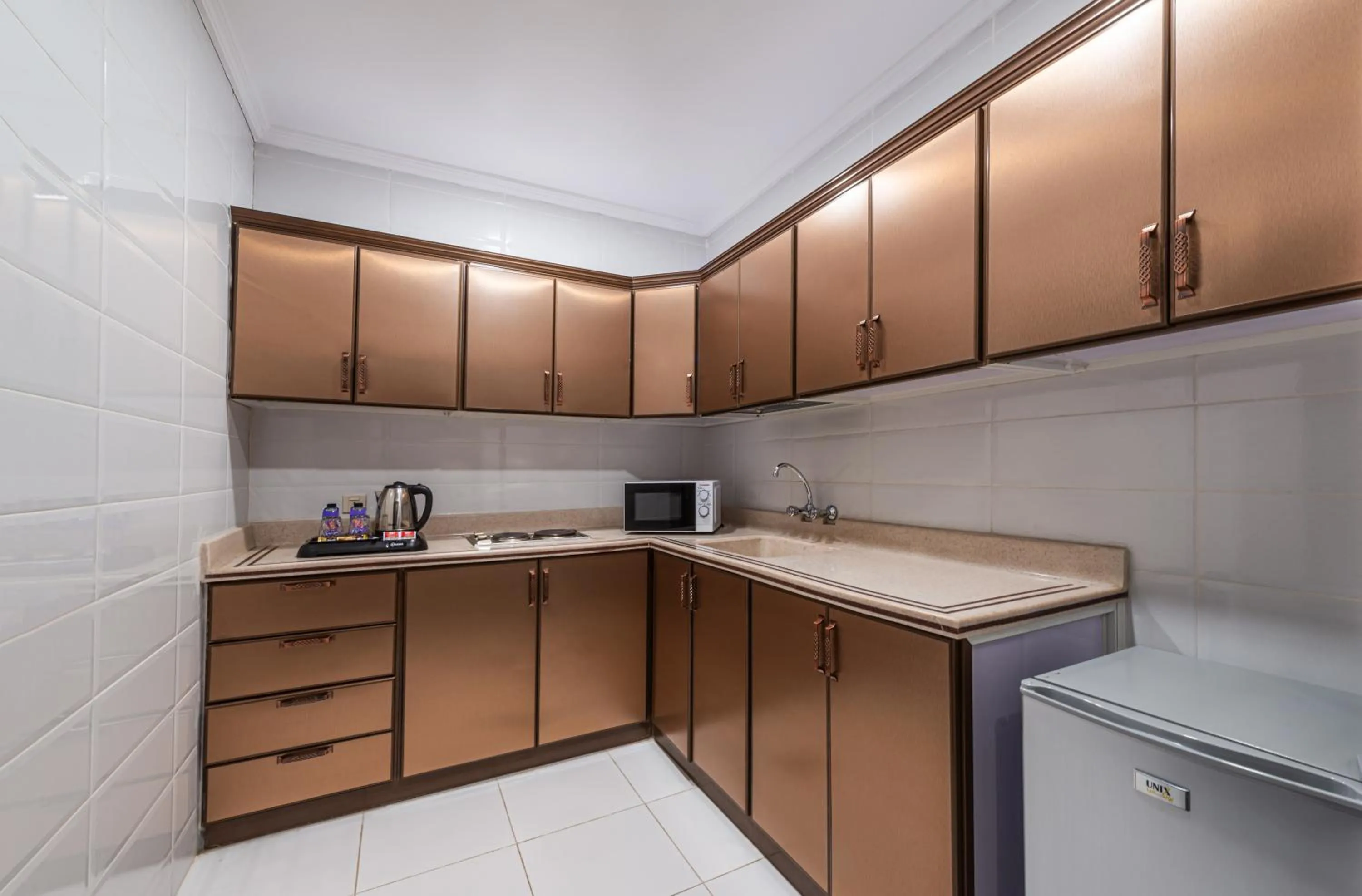 Kitchen or kitchenette in The Palaces Hotel Suites - Wadeen