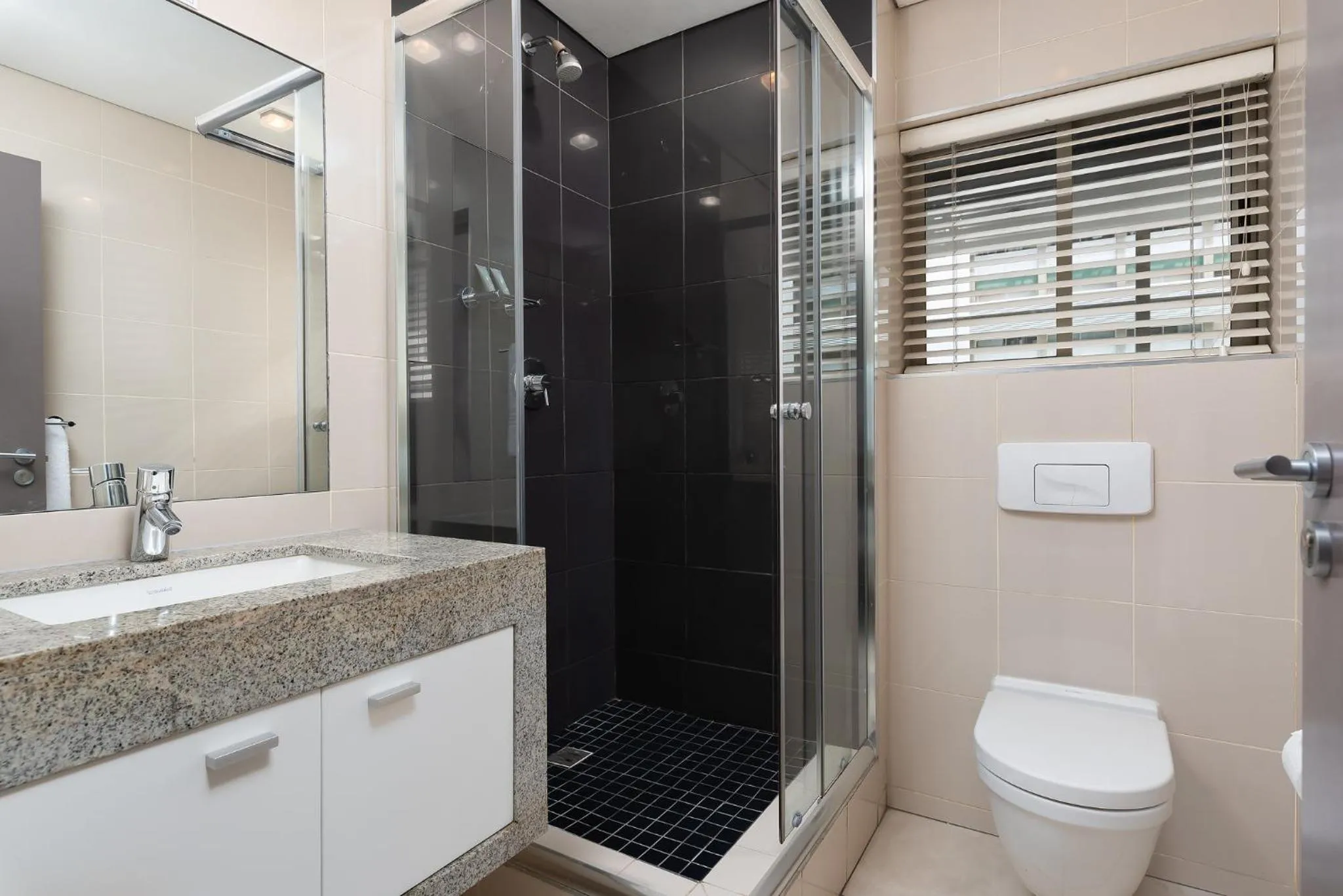Bathroom in HarbourEdge Suites by Totalstay