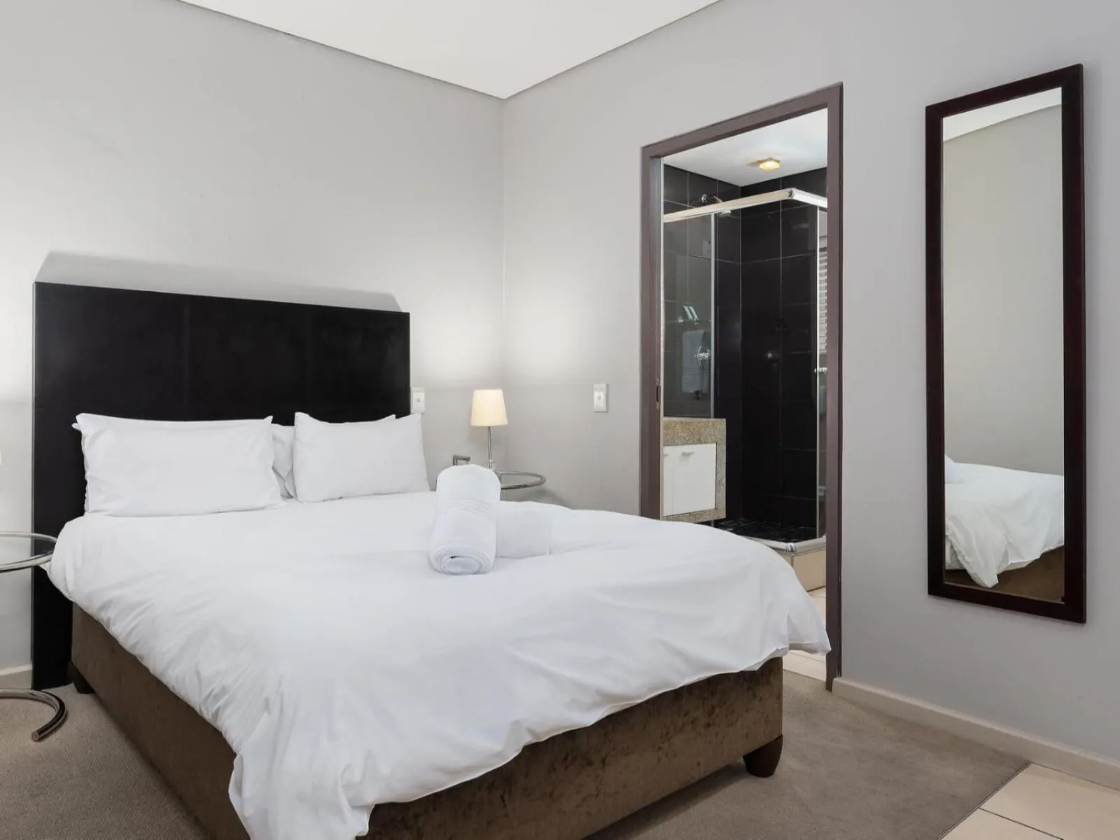 Bed in HarbourEdge Suites by Totalstay