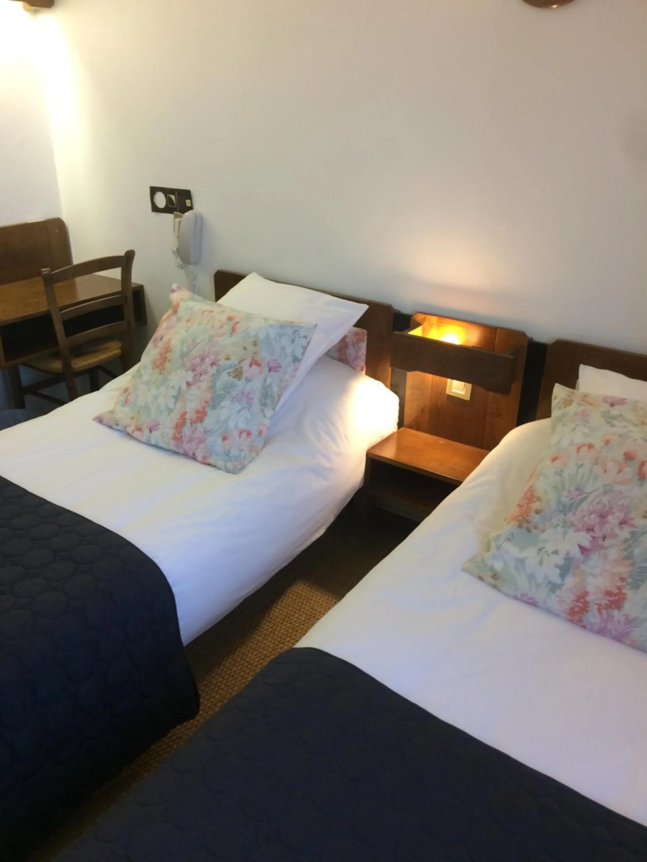 Bed in Logis Hôtel LE DAHU