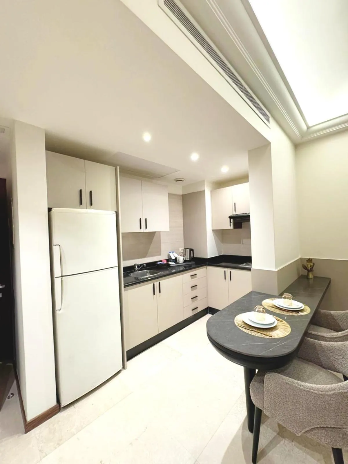 Kitchen or kitchenette in King Suites Hotel