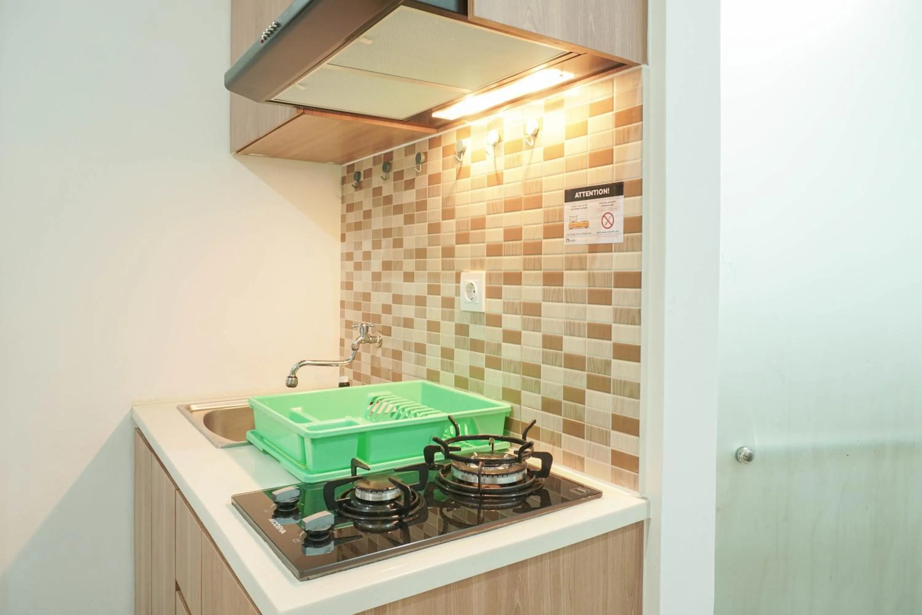 Lovely and Strategic Studio at Green Pramuka Apartment By Travelio
