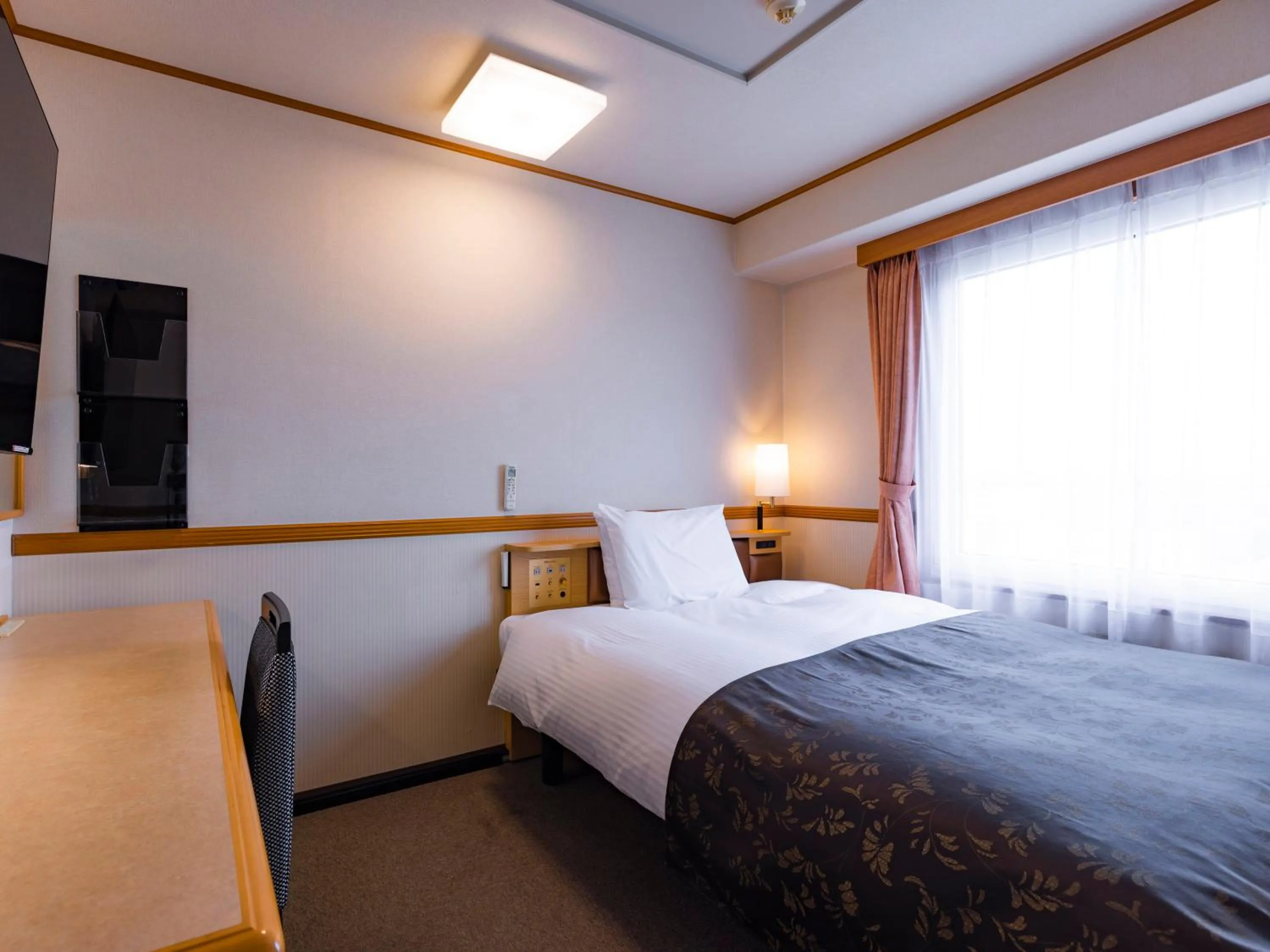 Photo of the whole room, Bed in APA Hotel Miyagi Furukawa Ekimae