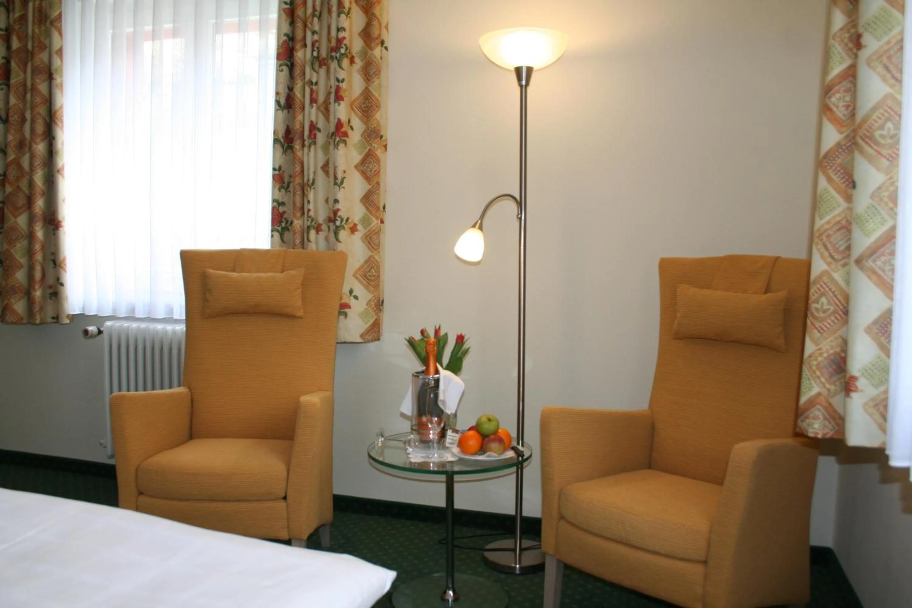 Seating area, Bed in Hotel Sonnenhof