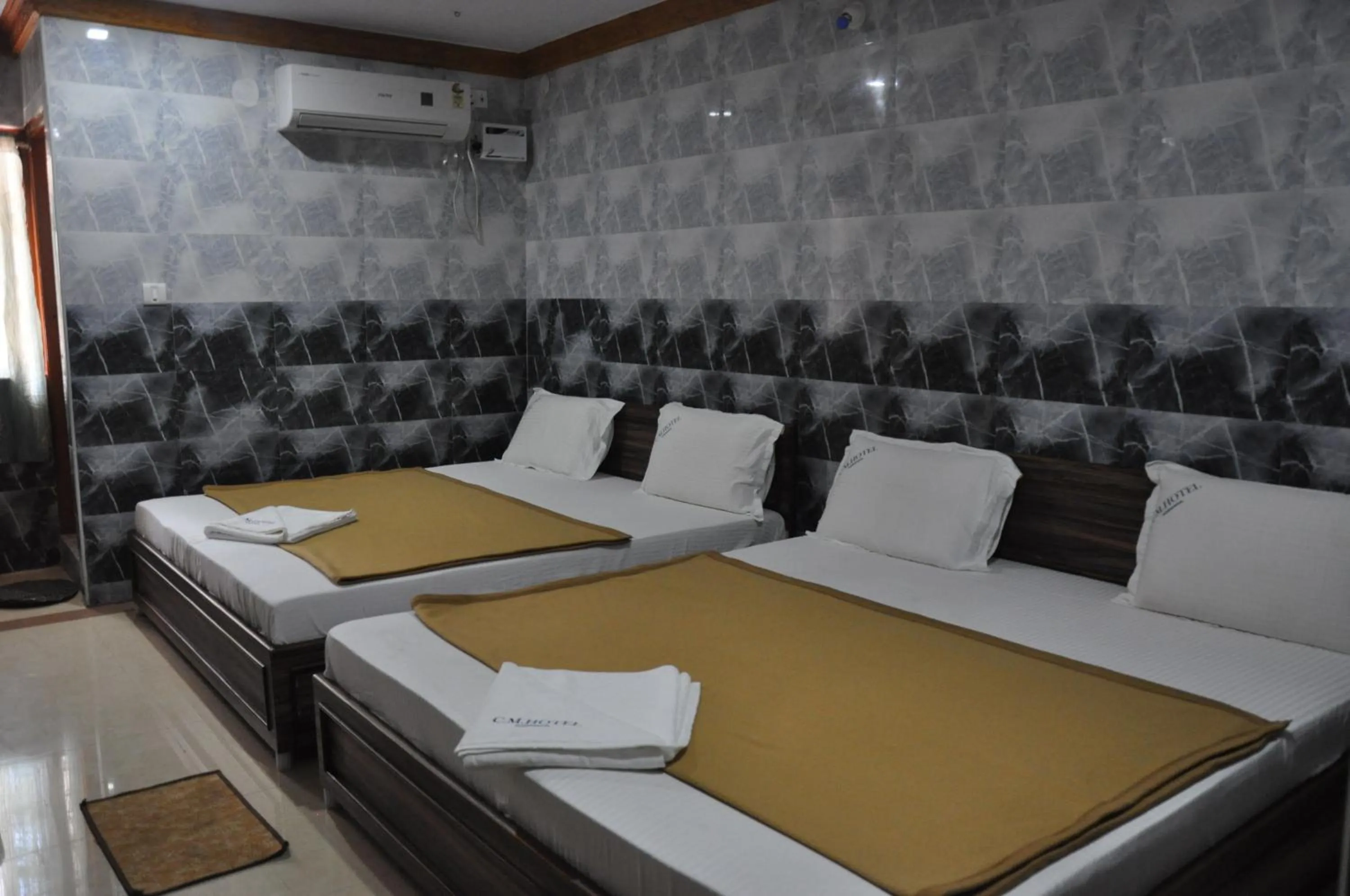 Bed in C M HOTEL NEW