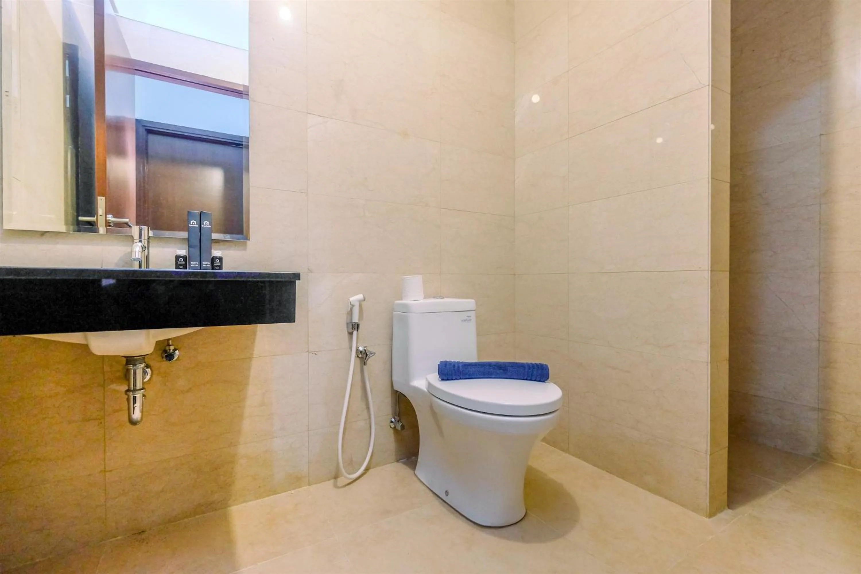 Bathroom in Brand New 2BR L'Avenue Apartment By Travelio