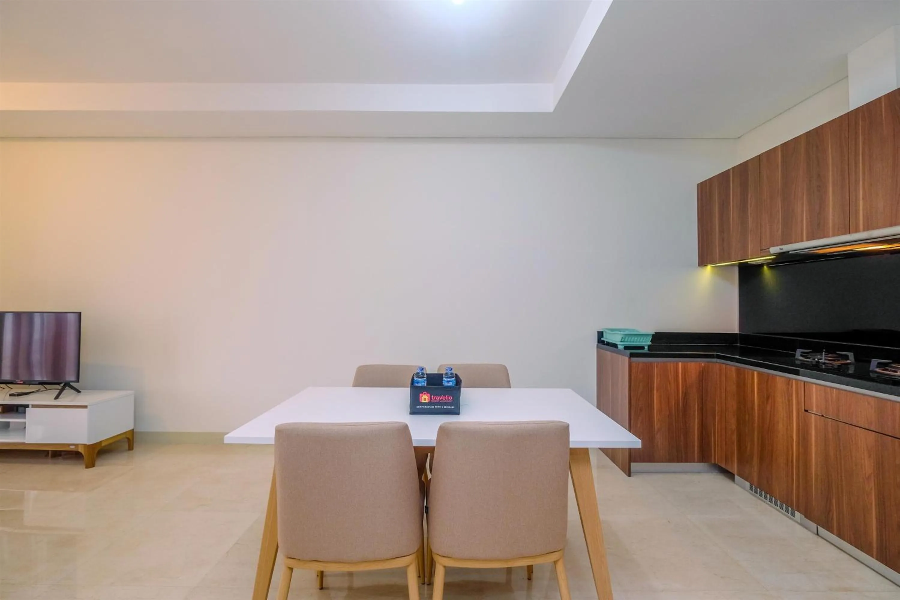 Dining area in Brand New 2BR L'Avenue Apartment By Travelio