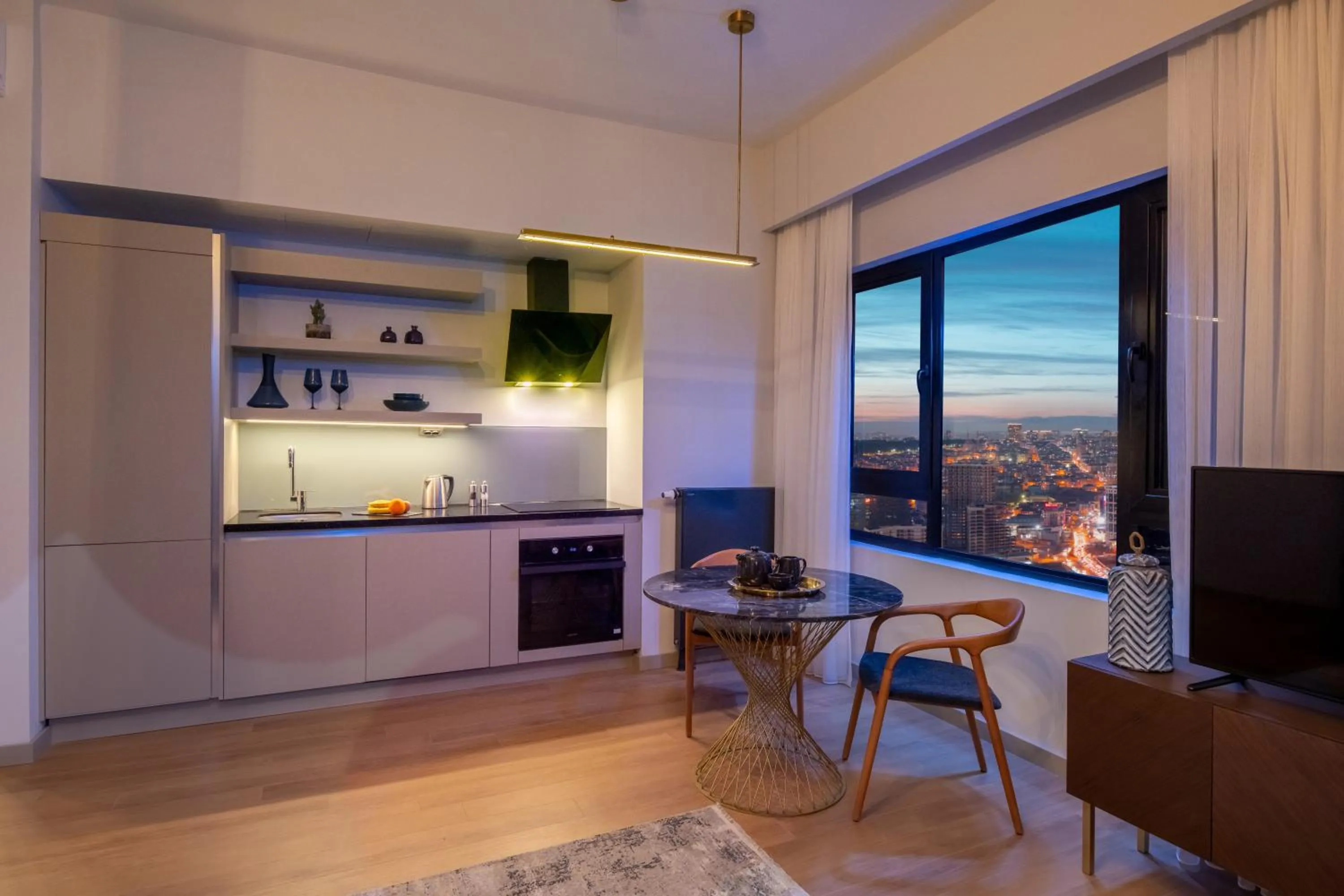 Communal lounge/ TV room in G Tower Furnished Apartment Rentals