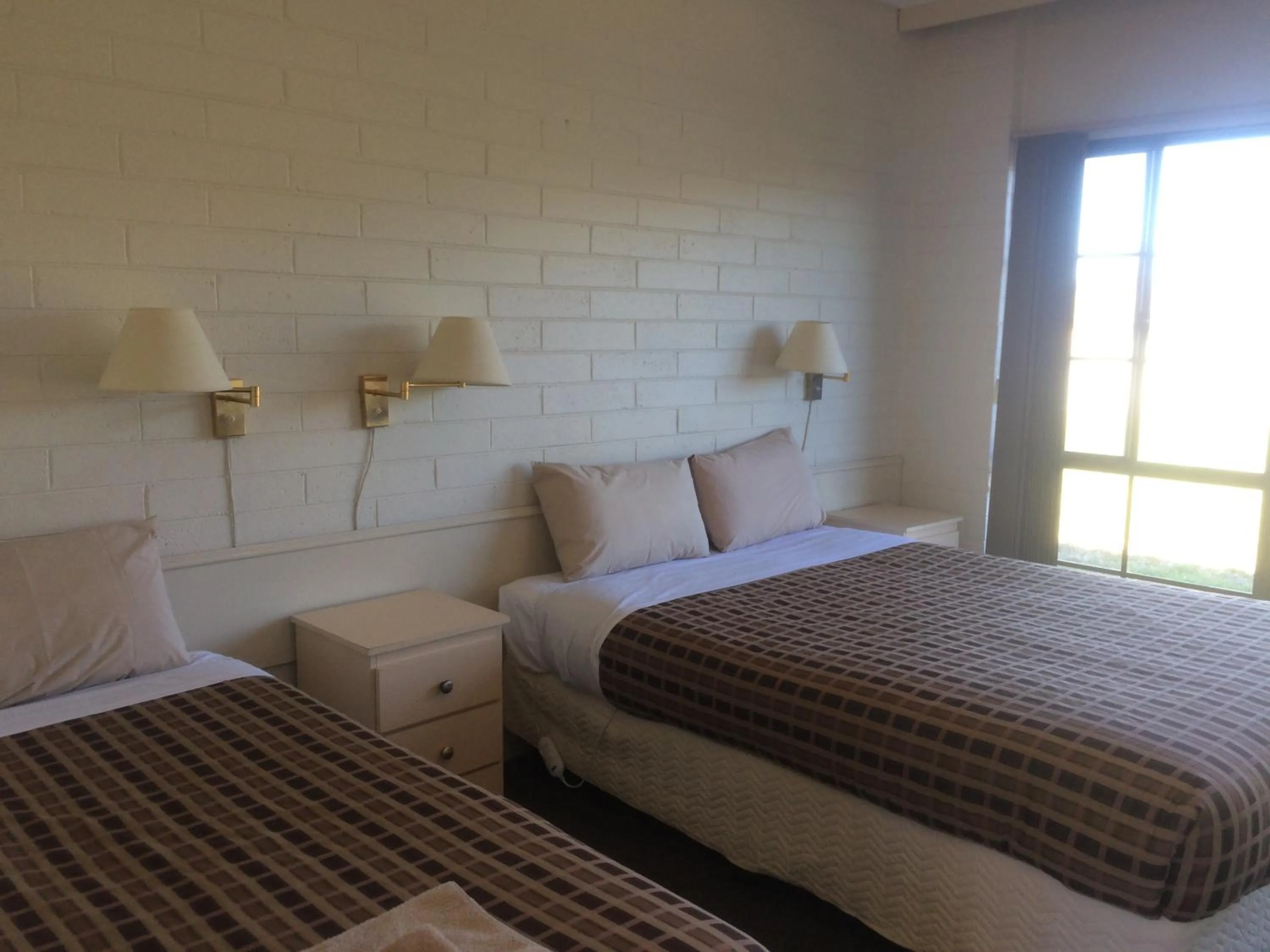 Bed in Ambassador Motor Inn