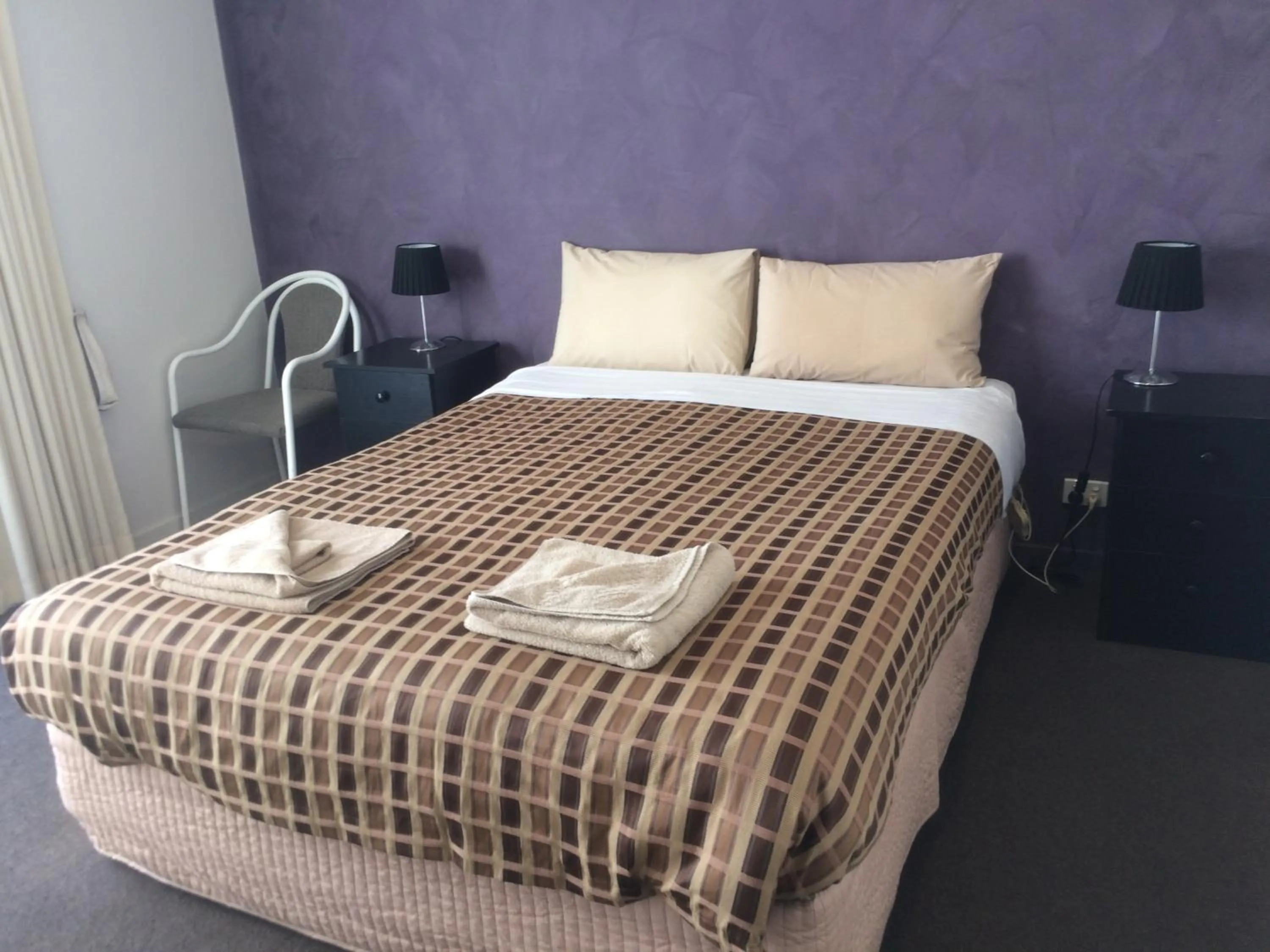 Bed in Ambassador Motor Inn