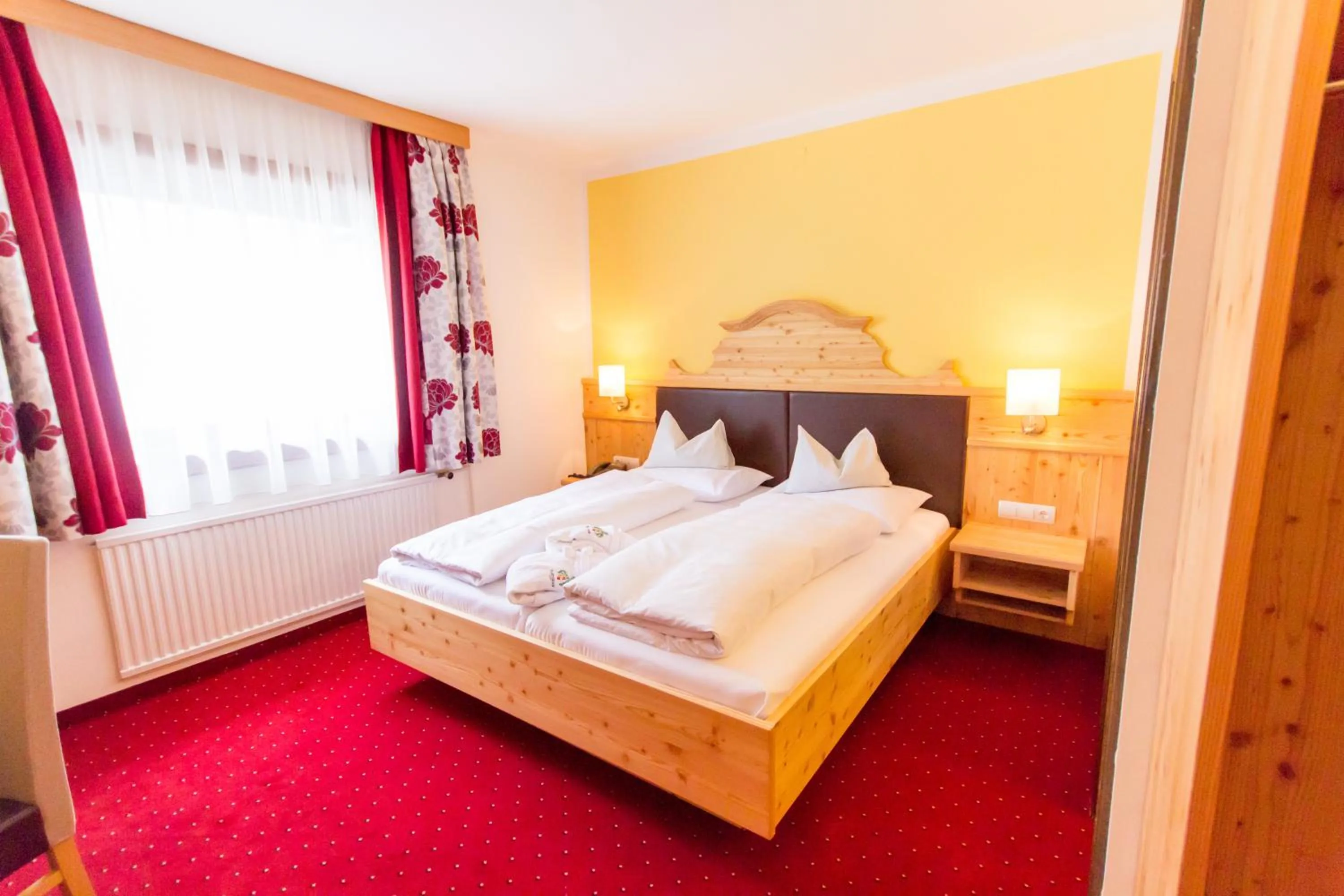 Bed in Hotel Trattlerhof