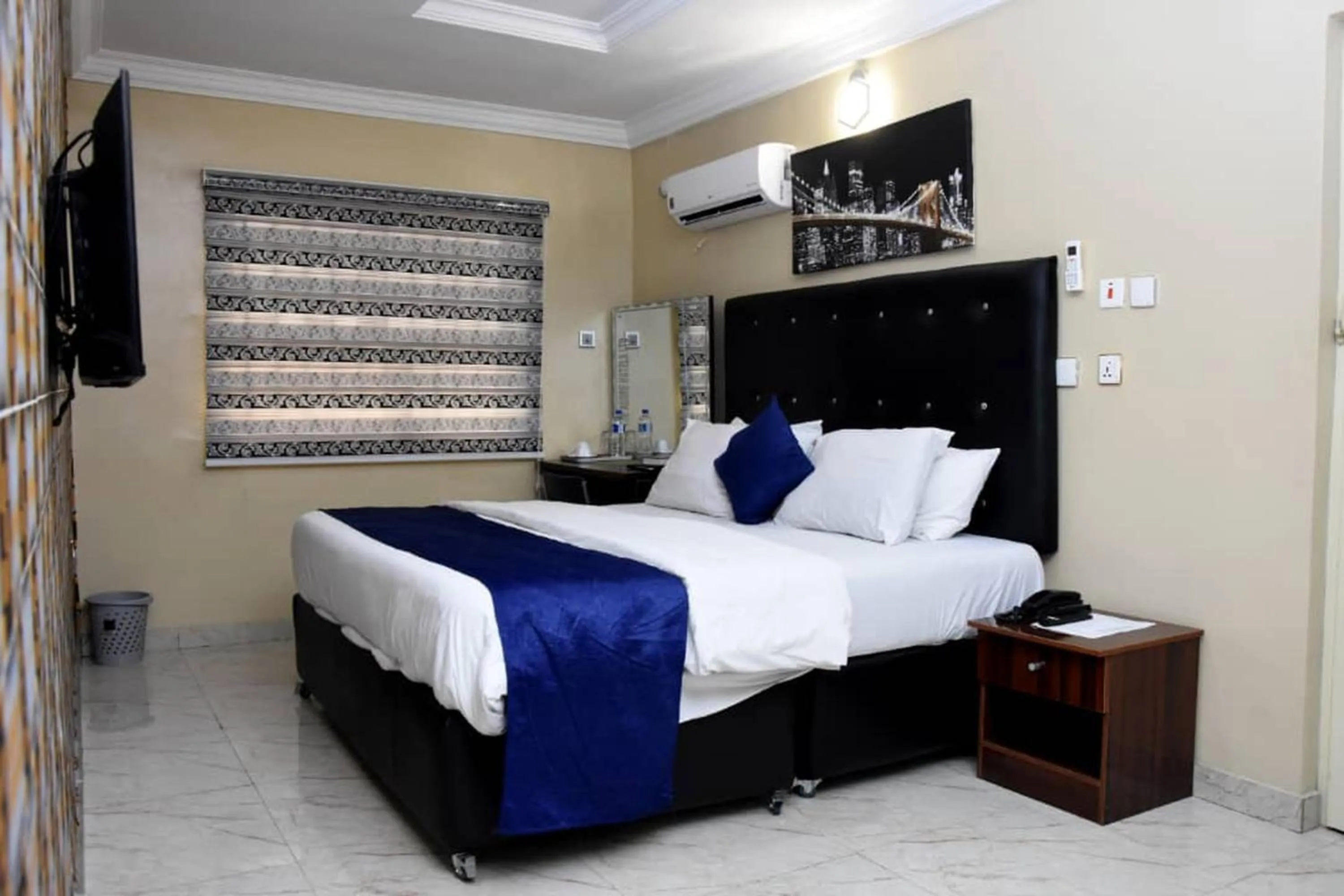 Bed in 24-7 Electricity Agore Hotels and Suites Ltd