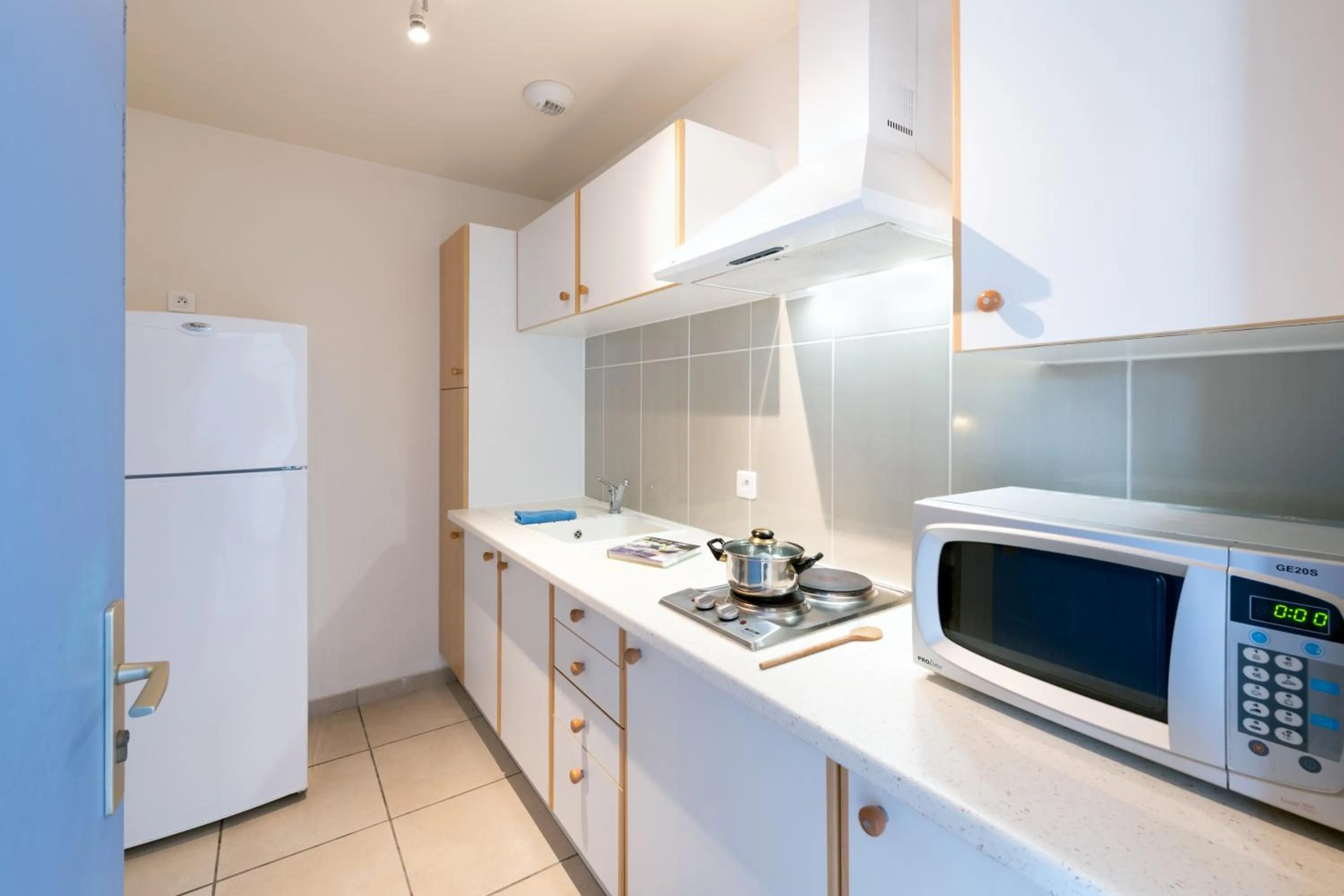 Kitchen or kitchenette in Résidence Amaréna