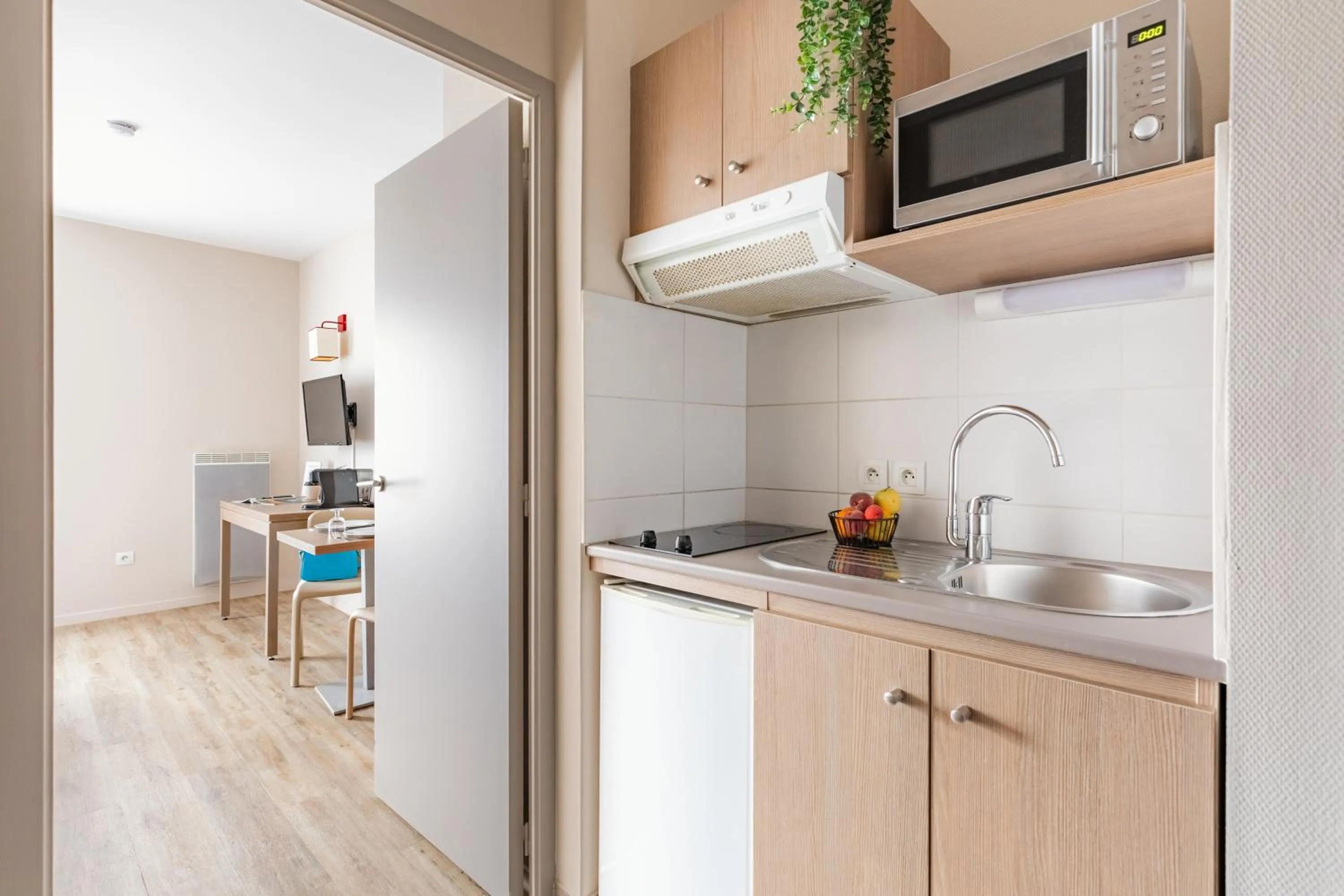 Kitchen or kitchenette in Appart'City Confort Cherbourg