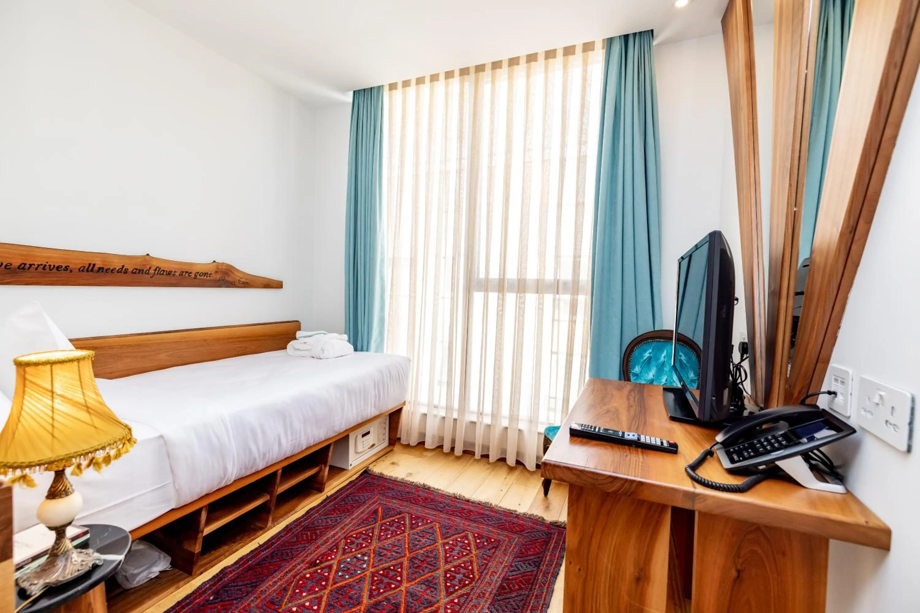 Bed in Limehouse Library Hotel