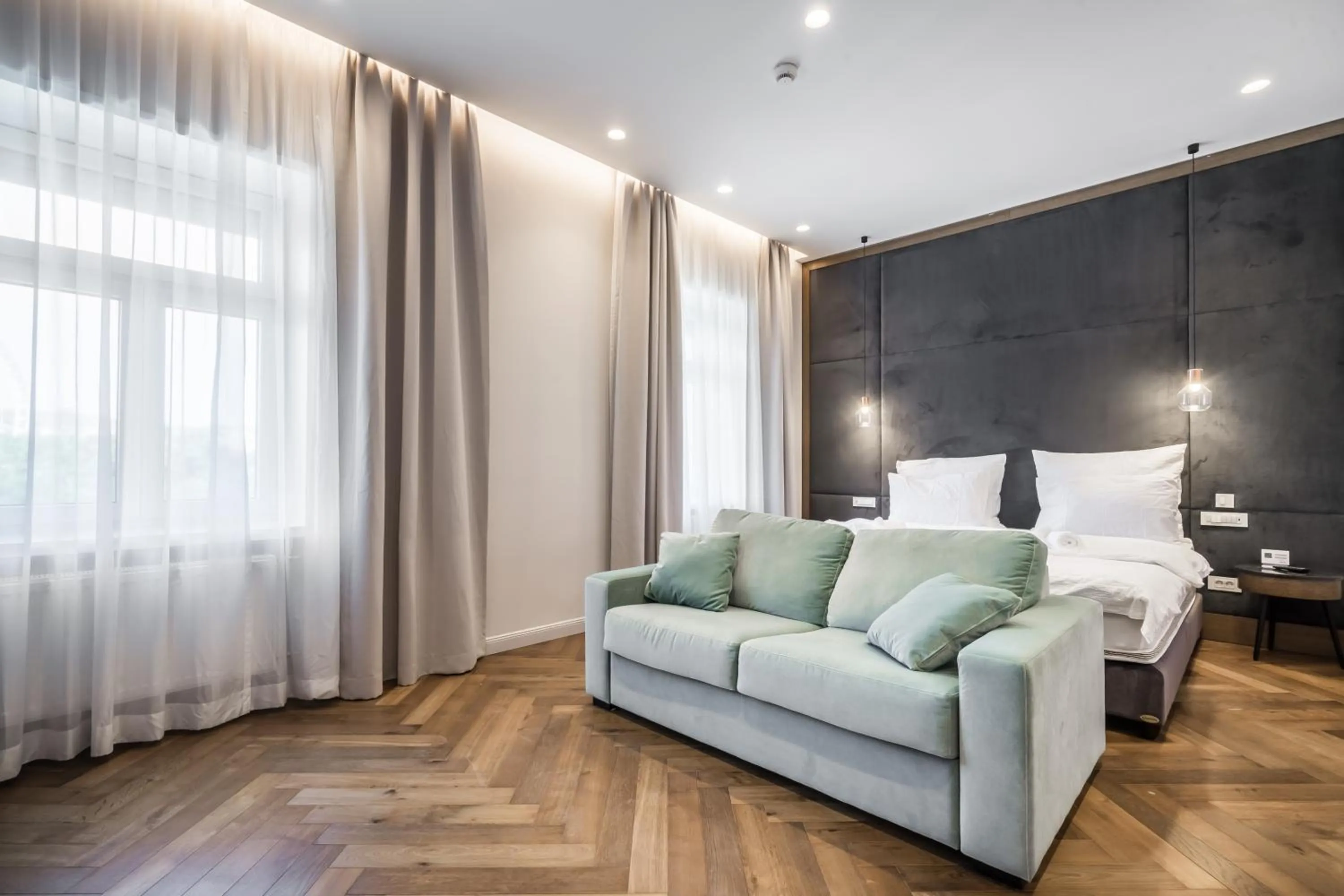Living room, Bed in Budapest Eye- Boutique Suites, by BQA