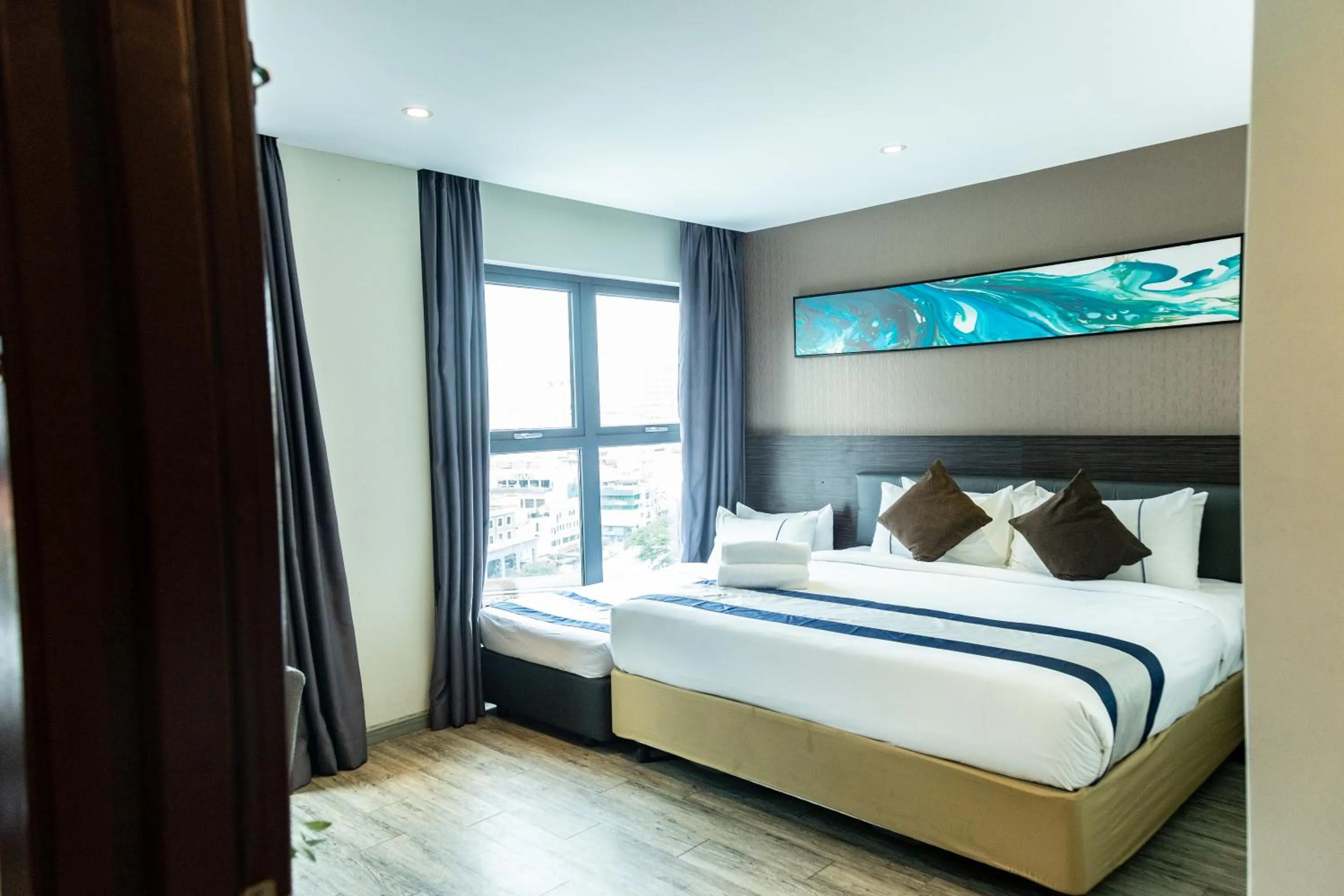 Photo of the whole room, Bed in Ramada Encore by Wyndham Chinatown Kuala Lumpur