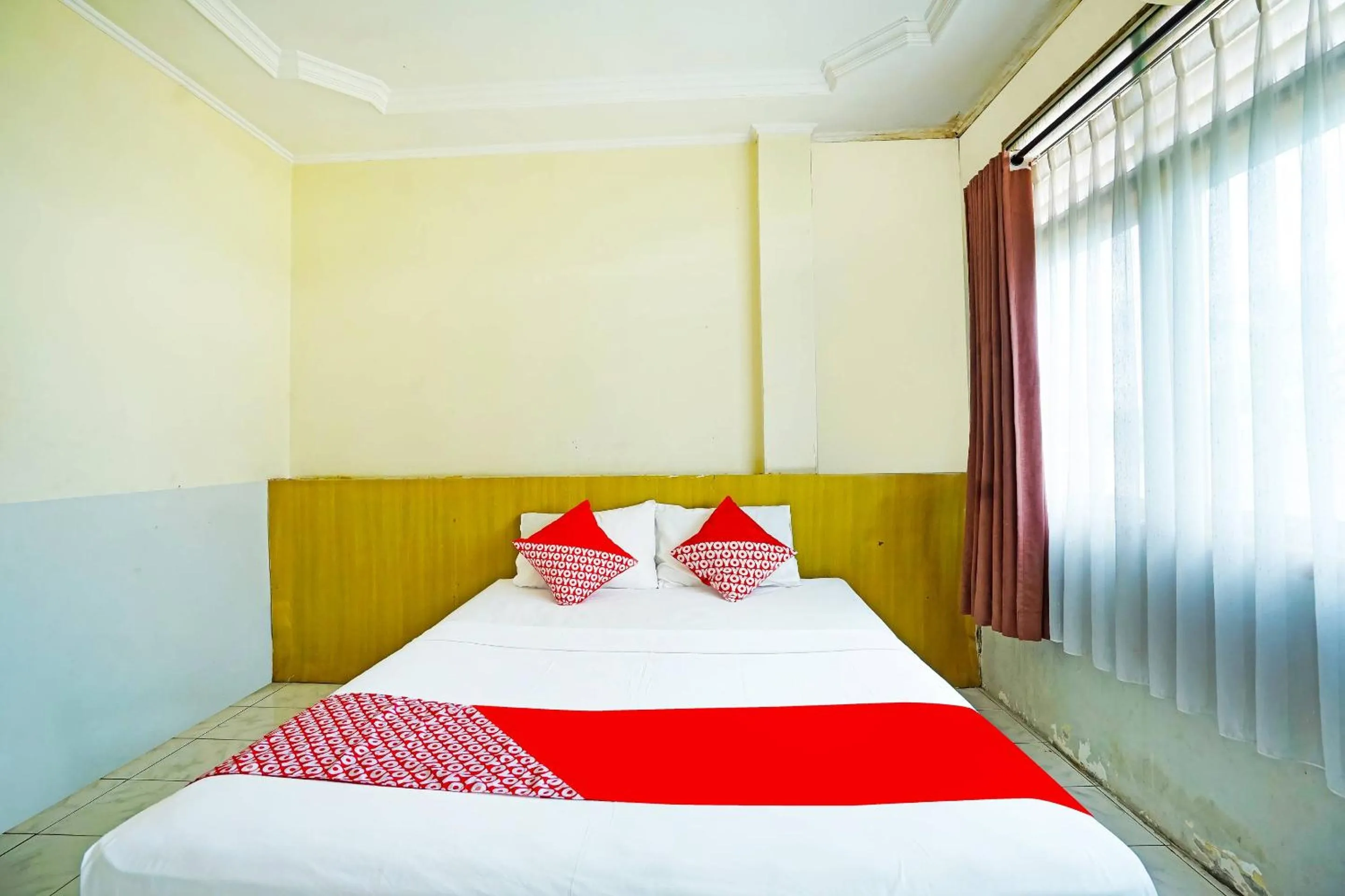 Bedroom in OYO 90390 Hotel Rd Premium