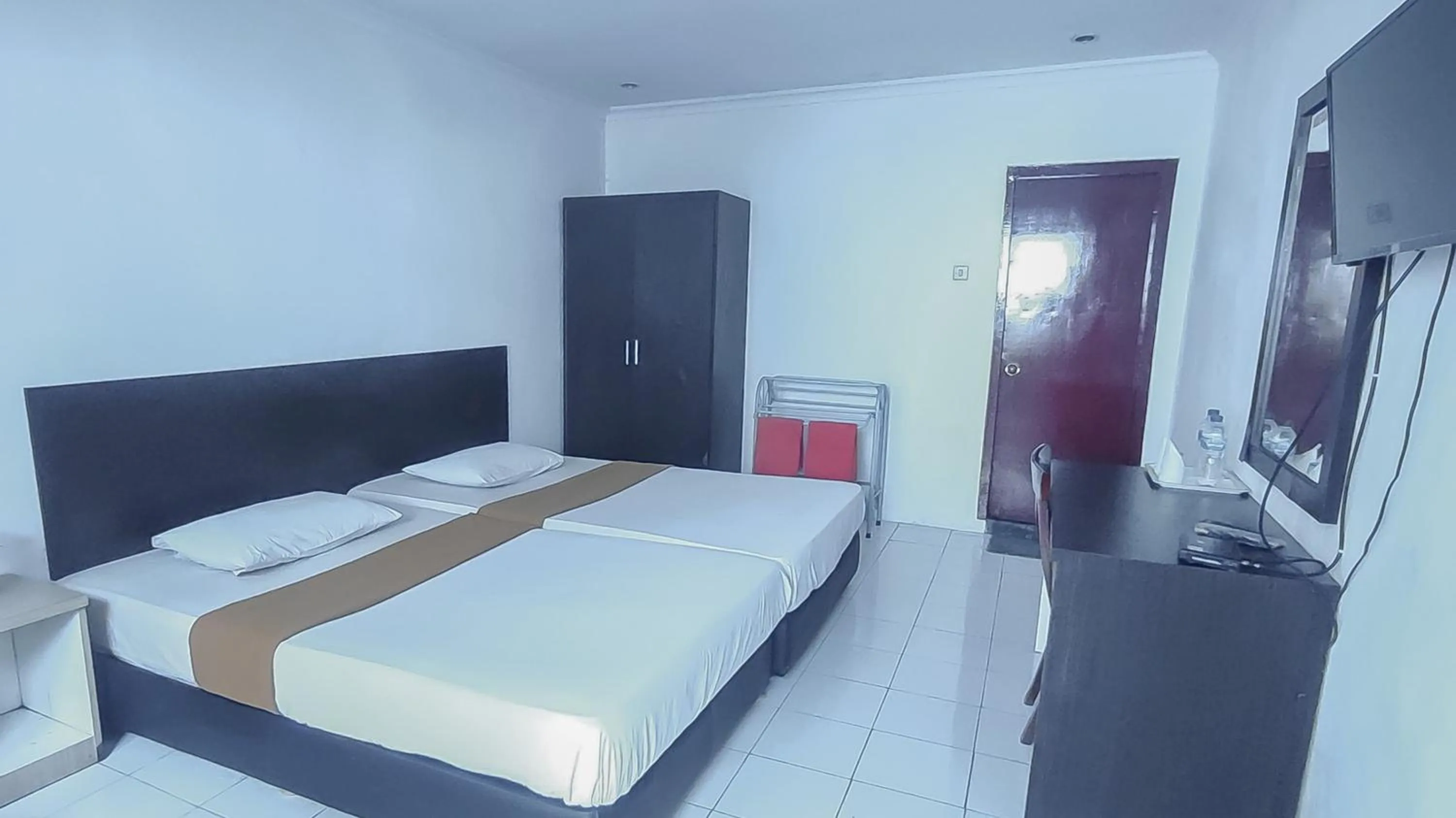 Bed in Burangrang Village Mitra RedDoorz