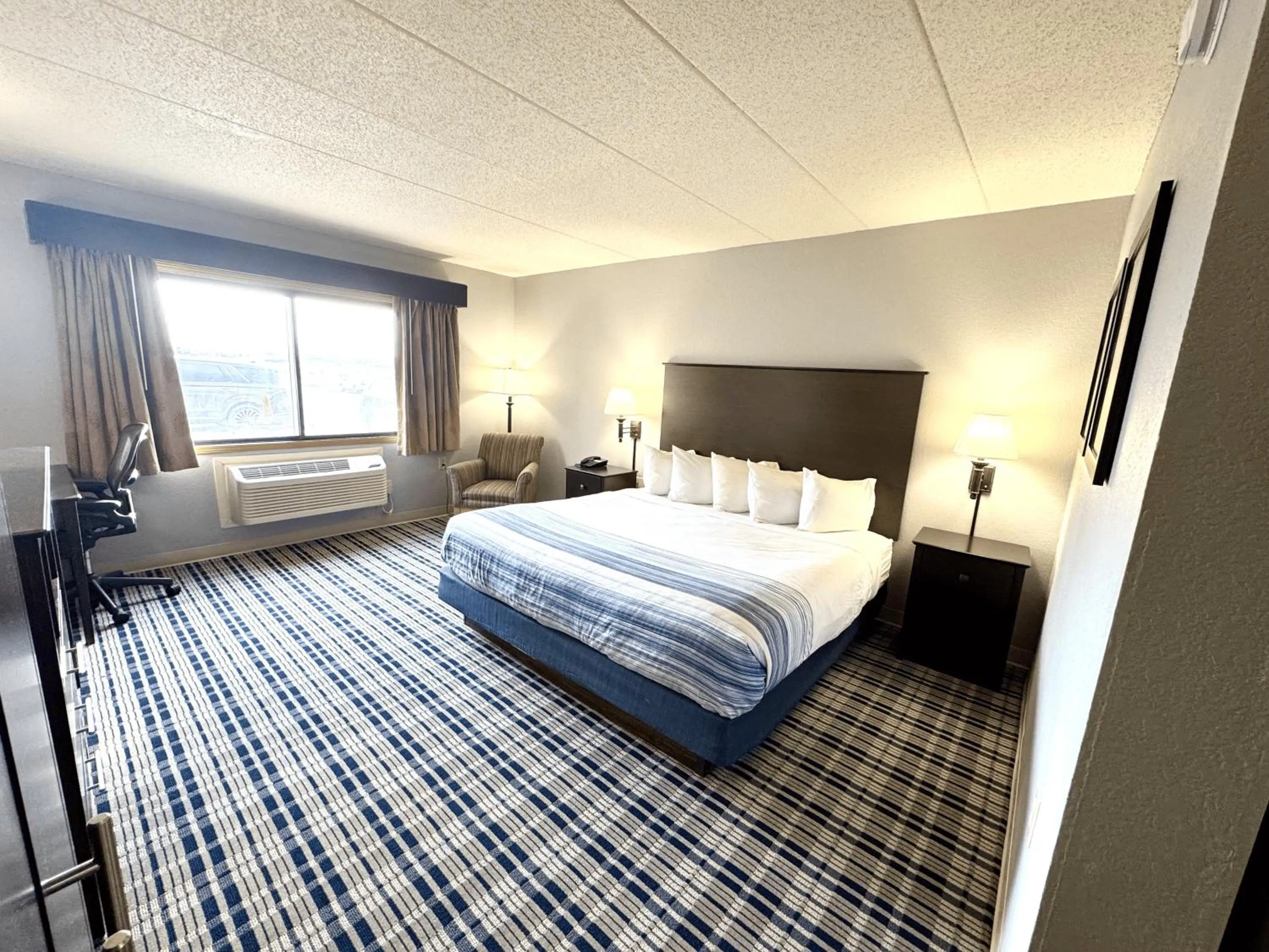 Bedroom, Bed in AmericInn by Wyndham Ames