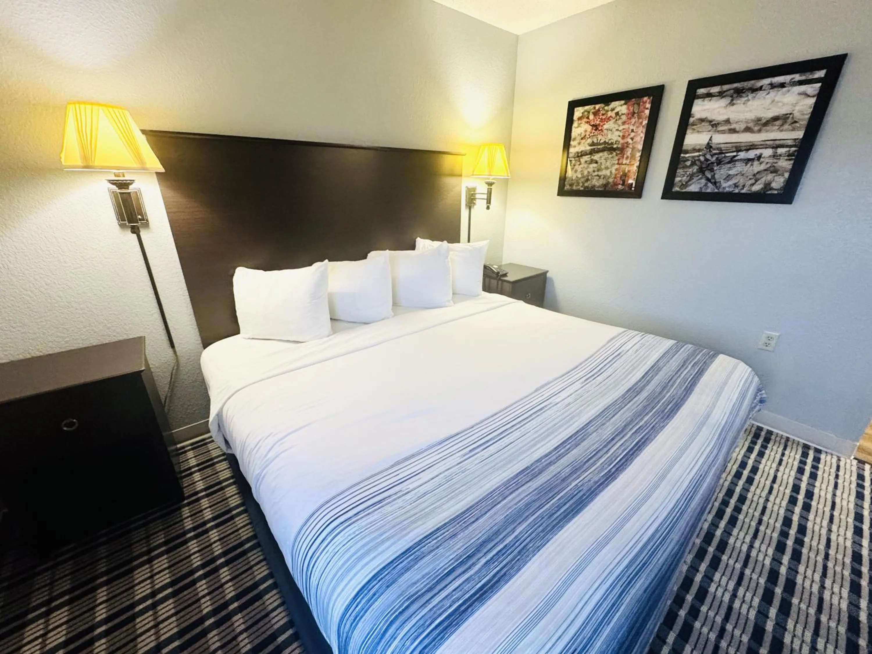 Bedroom, Bed in AmericInn by Wyndham Ames