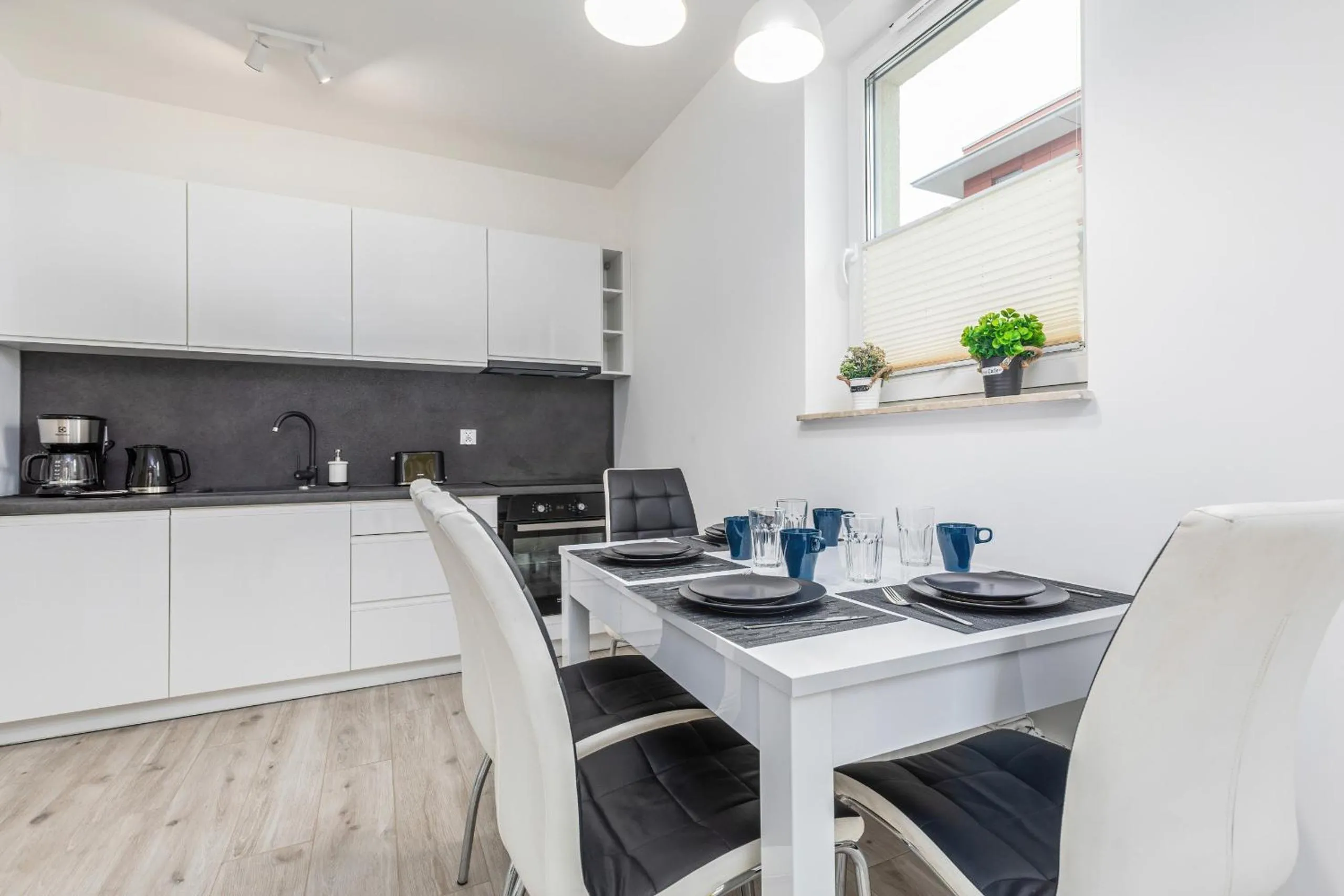 Kitchen or kitchenette in Apartamenty Osiedle Bursztynowe II by Noclegi Renters