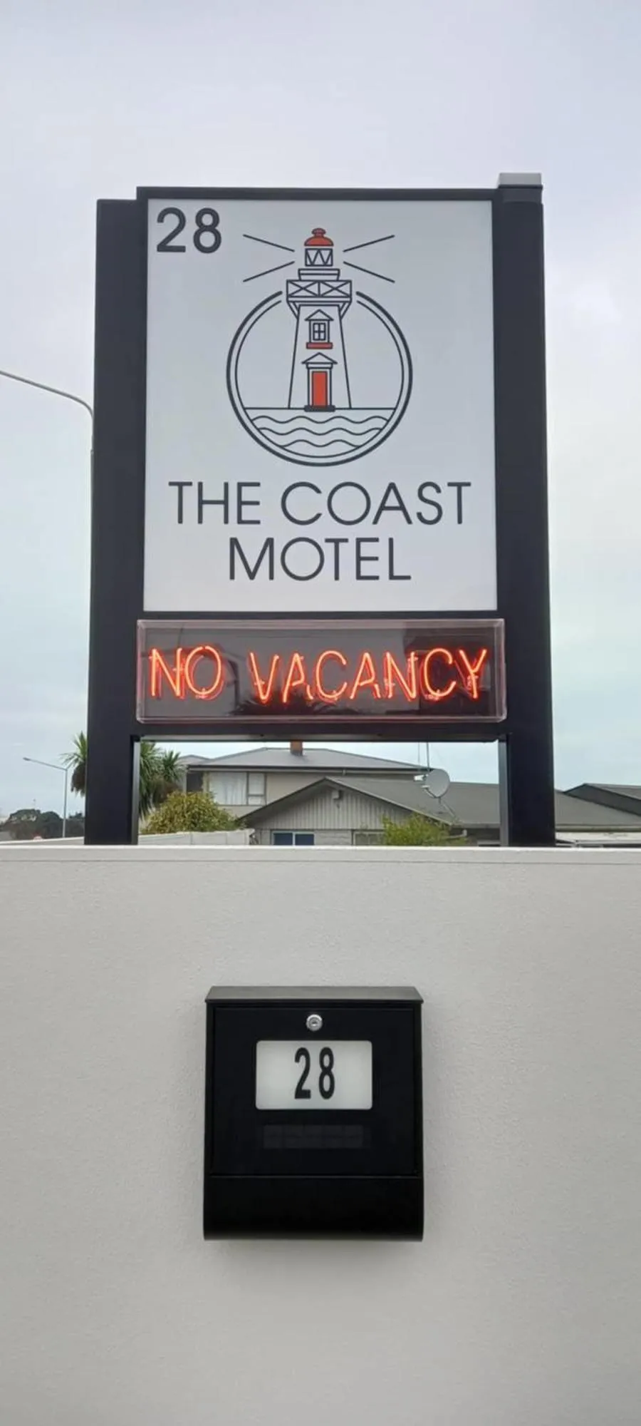 Property logo or sign in The Coast Motel