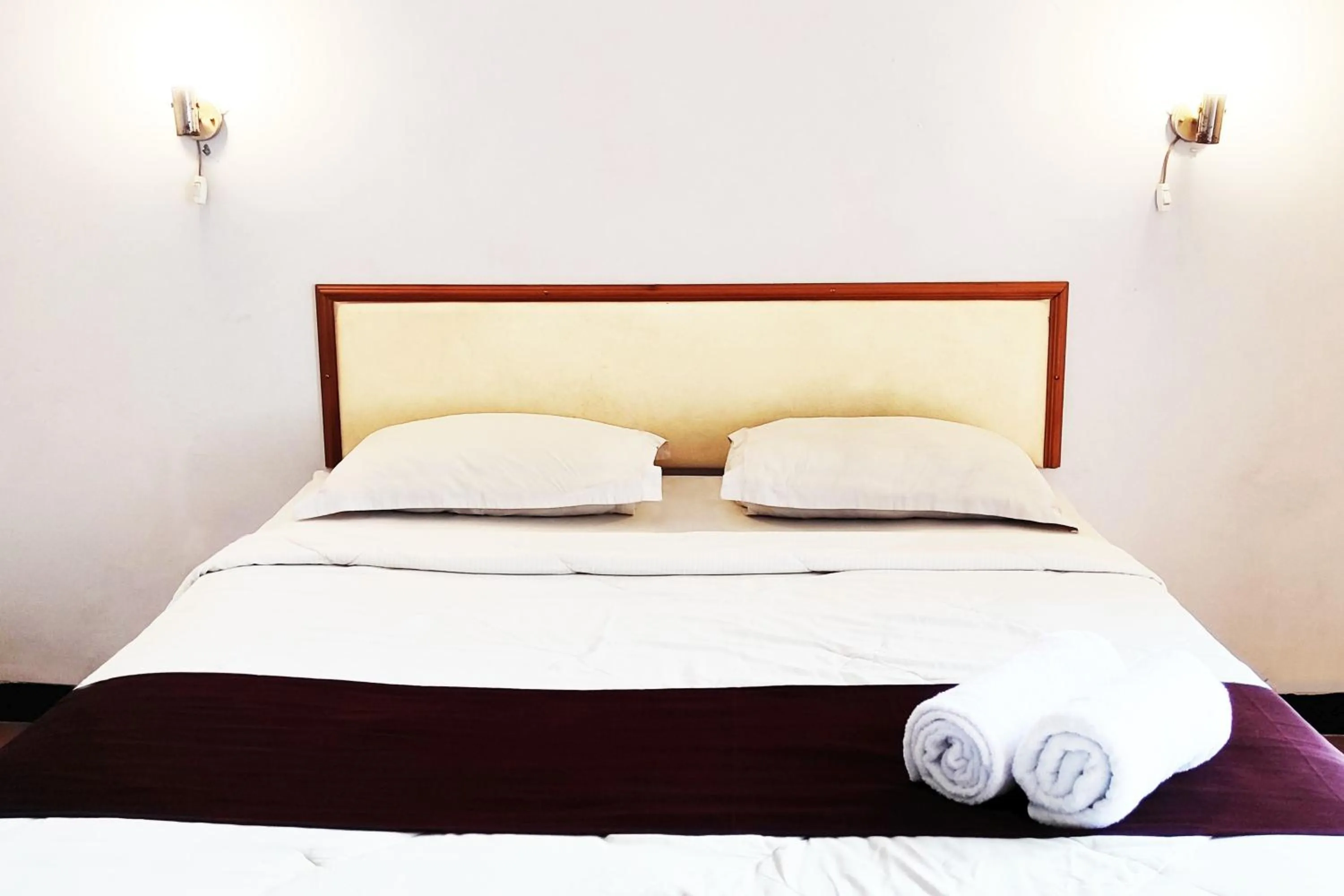 Bed in Hotel Salma Syariah Mitra RedDoorz near Terminal Baru Kediri