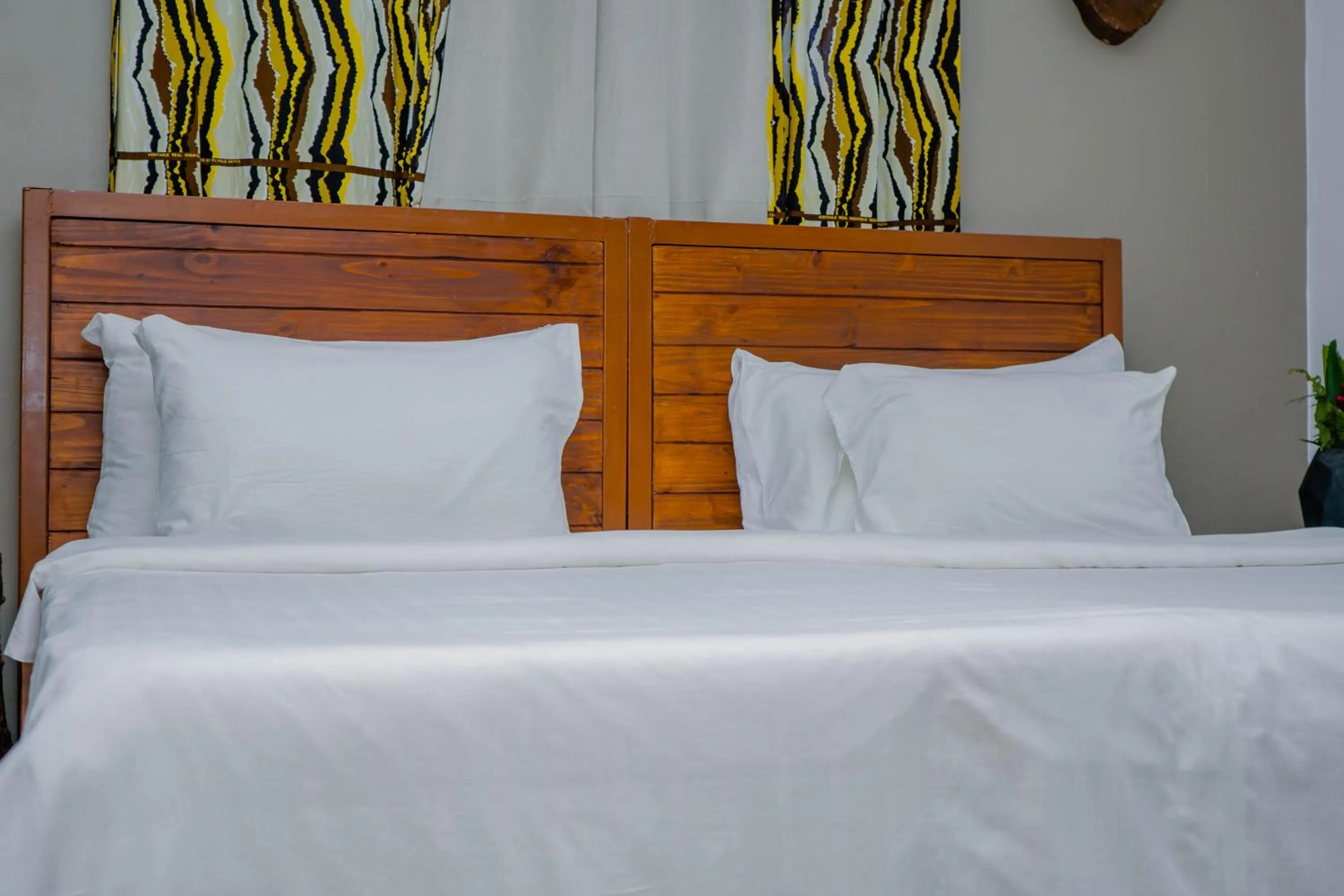 Bed in Tulivu Kilimanjaro Retreat