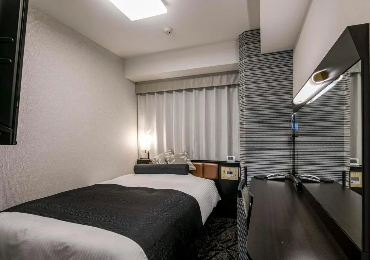 Photo of the whole room, Bed in APA Hotel Nagoya Ekimae