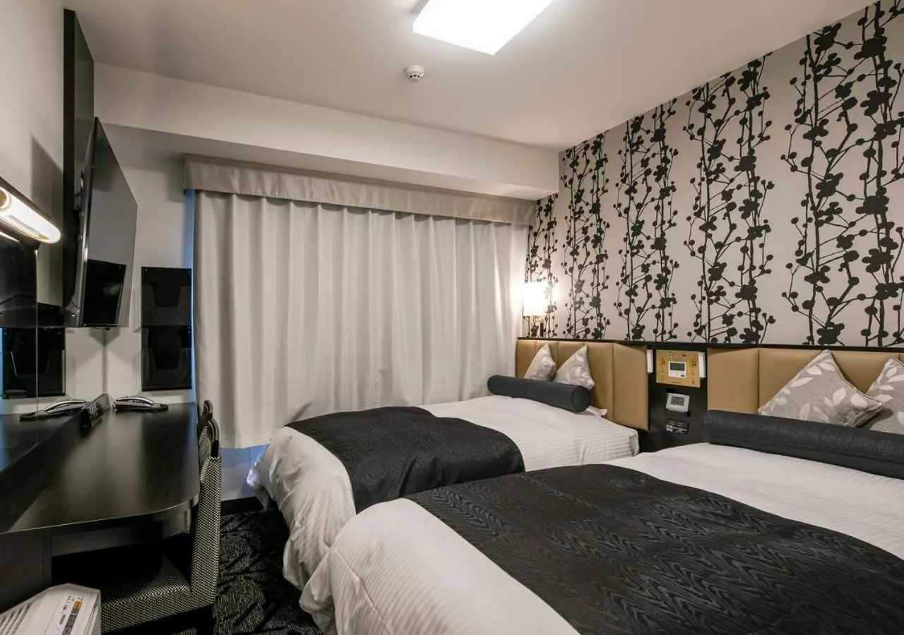 Photo of the whole room, Bed in APA Hotel Nagoya Ekimae