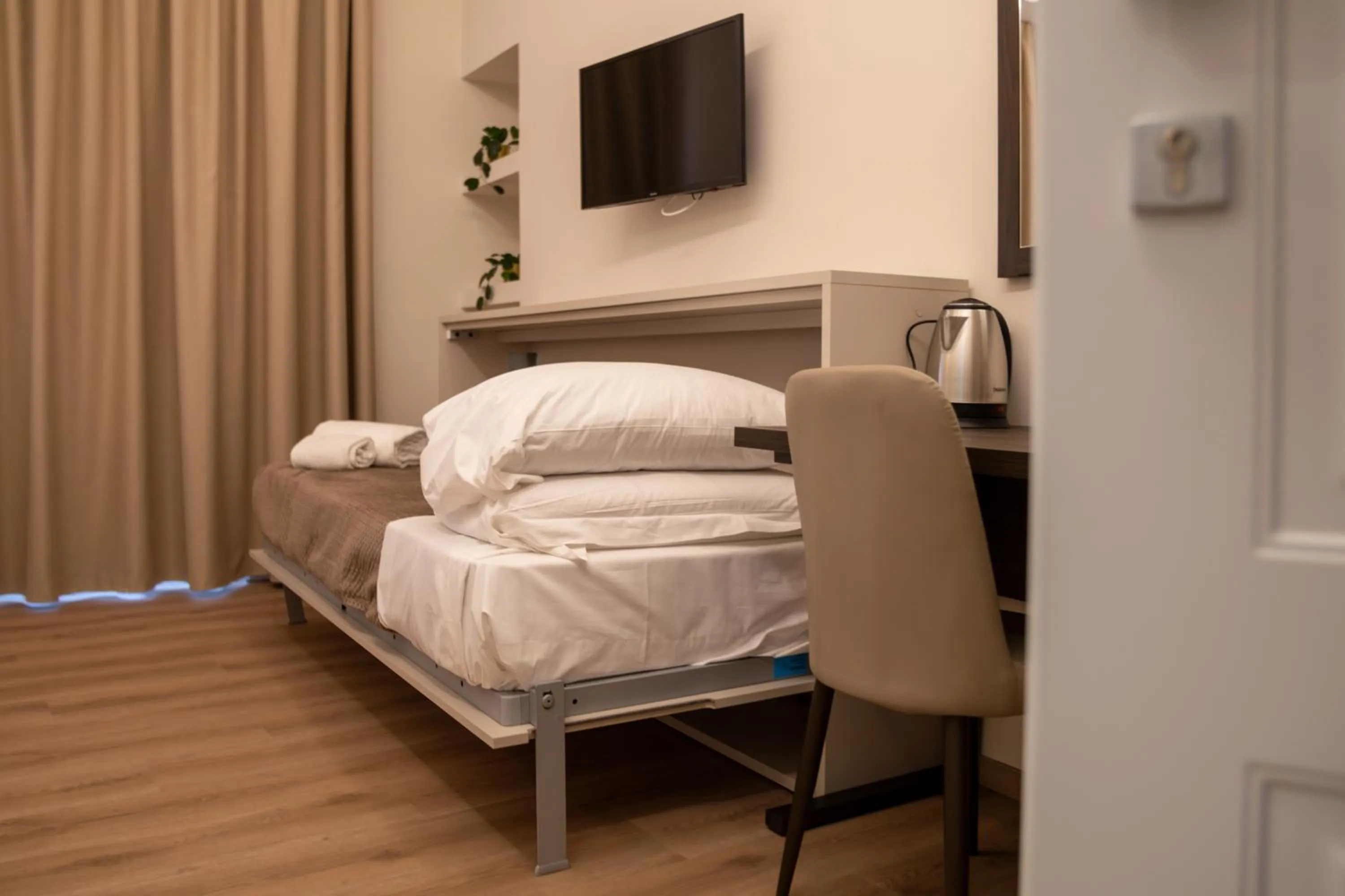 Bed in Palazzo Cappuccini Art Relais