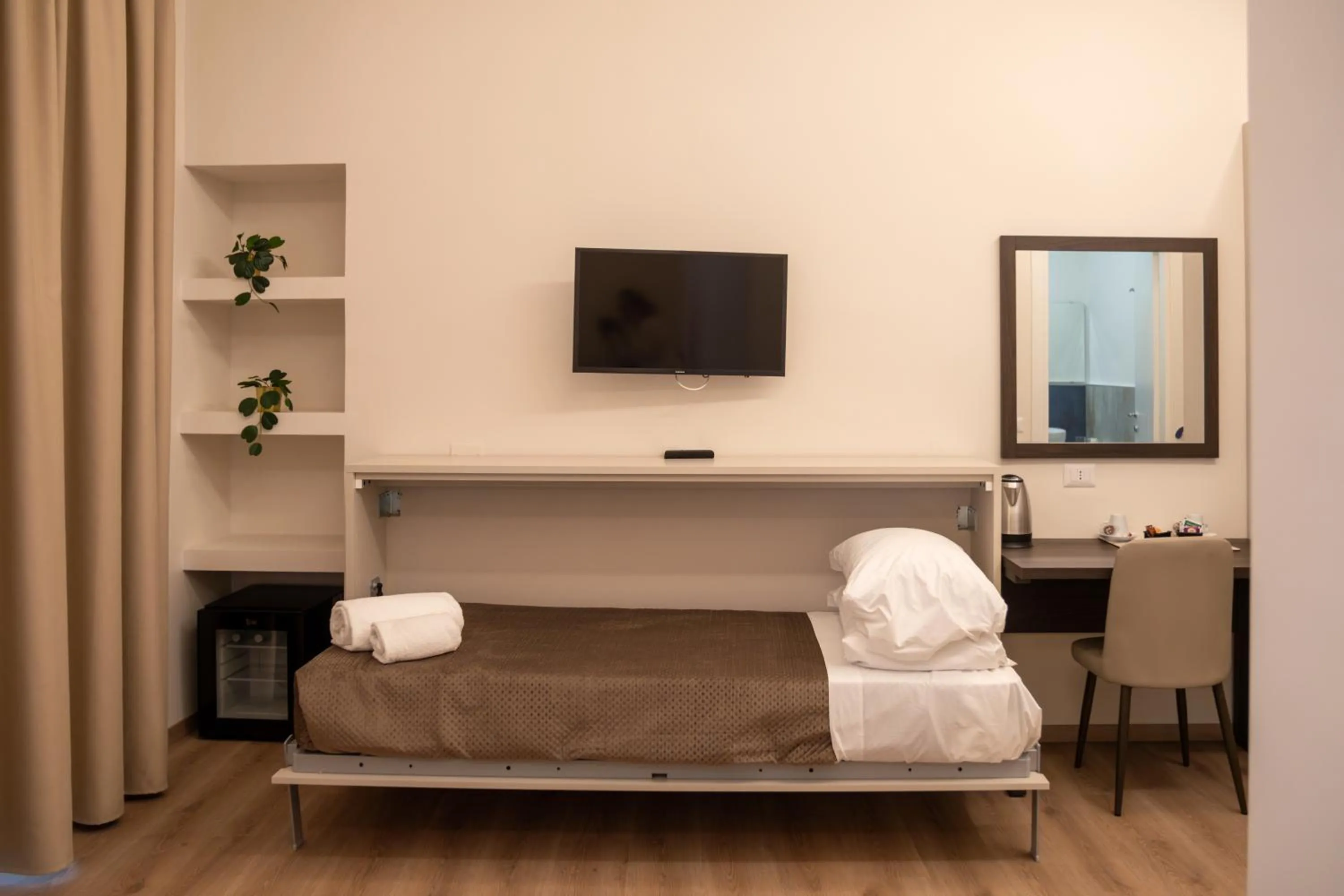 Bed in Palazzo Cappuccini Art Relais