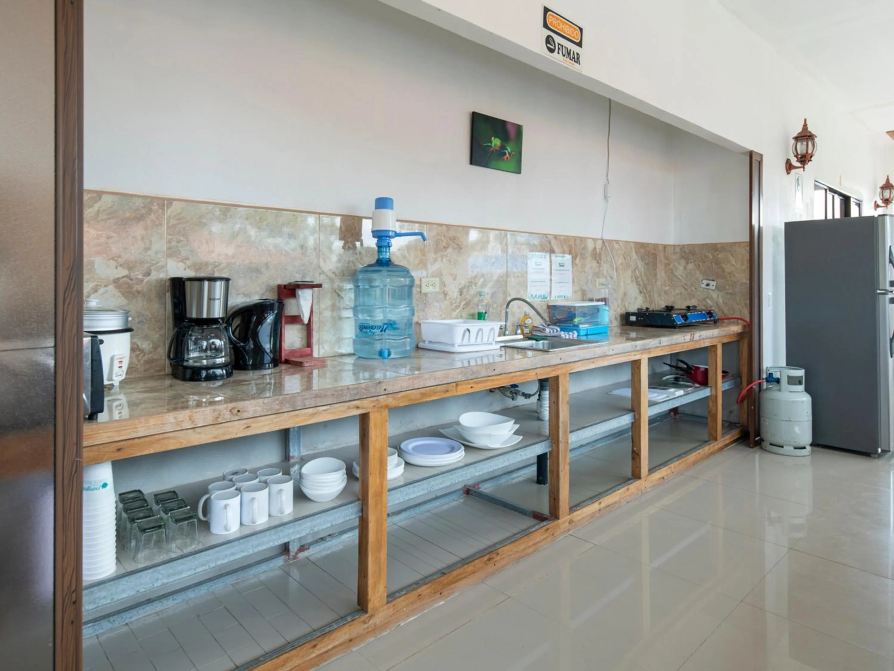 Communal kitchen in Pangea Lodge with Shared Pool at the Heart of Manzanillo