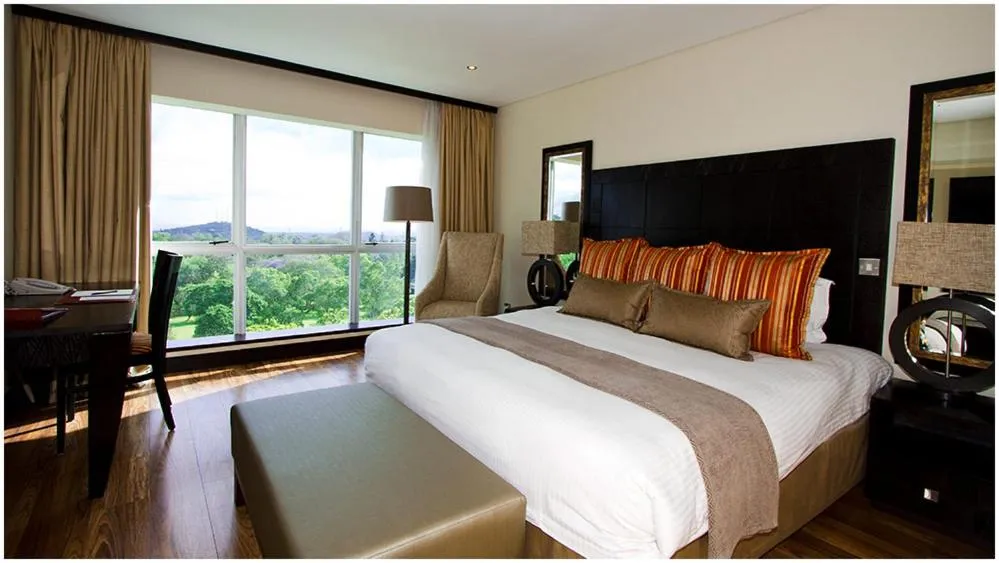 Bed in Mount Meru Hotel