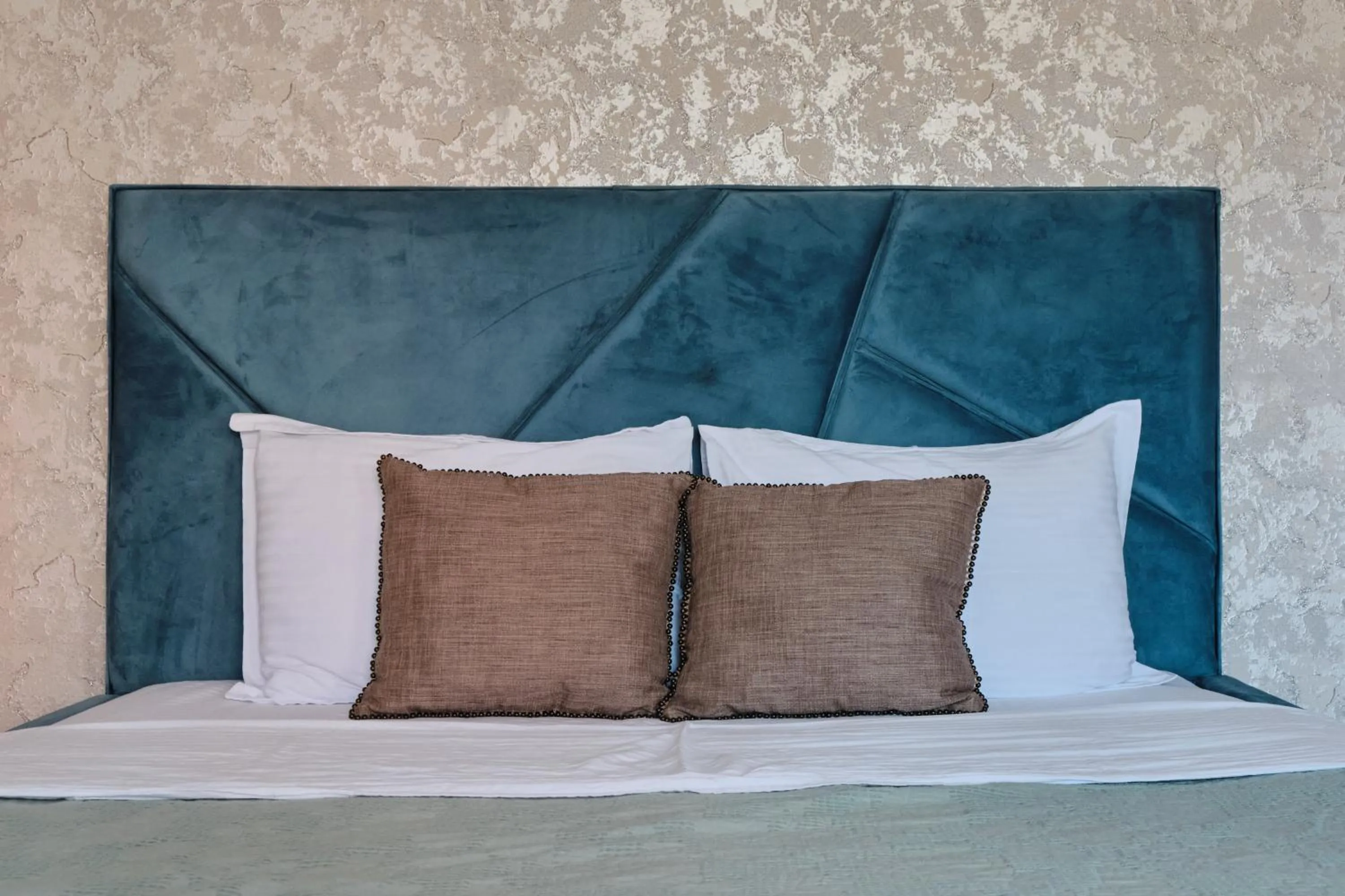 Bed in Seven City Apartments