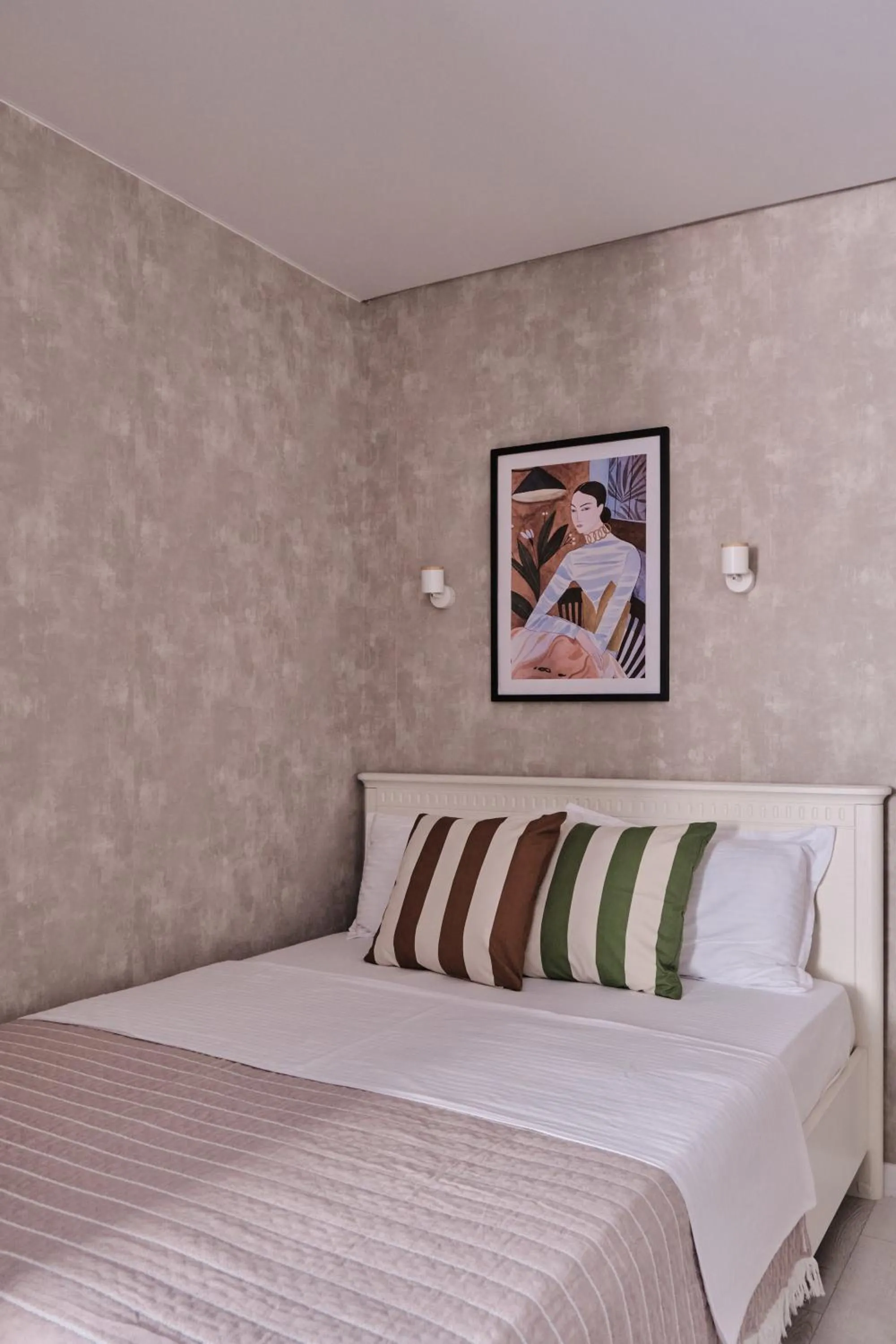 Bed in Seven City Apartments