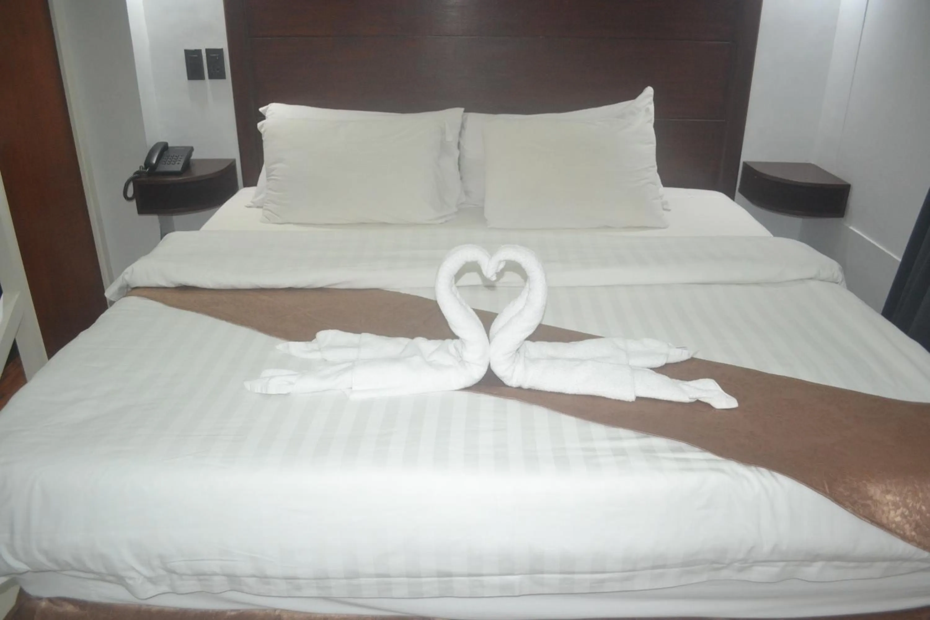 Bed in DM Residente Hotel Inns & Villas