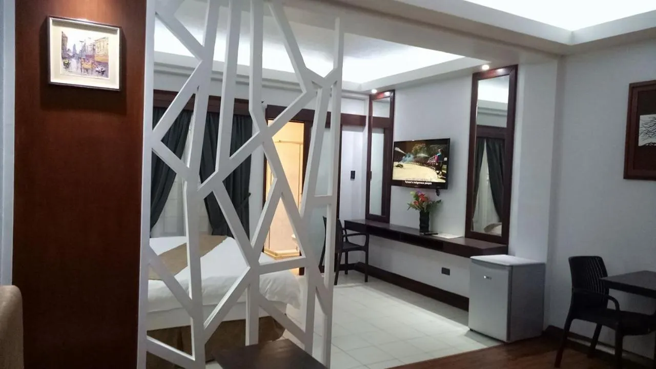 Bedroom in DM Residente Hotel Inns & Villas