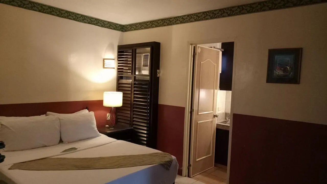 Bedroom, Bed in DM Residente Hotel Inns & Villas