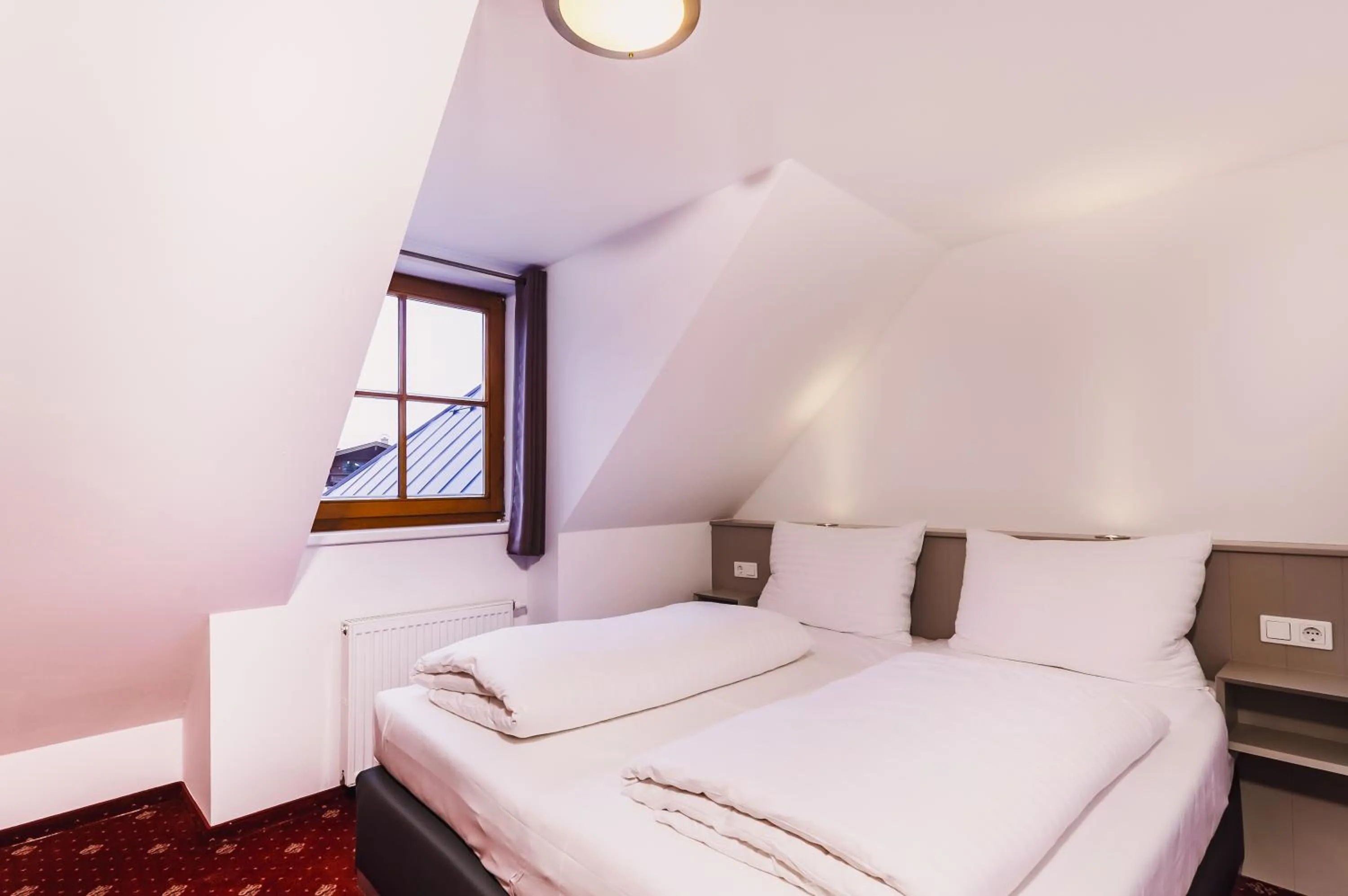 Bed in Kitz Residenz by Alpin Rentals